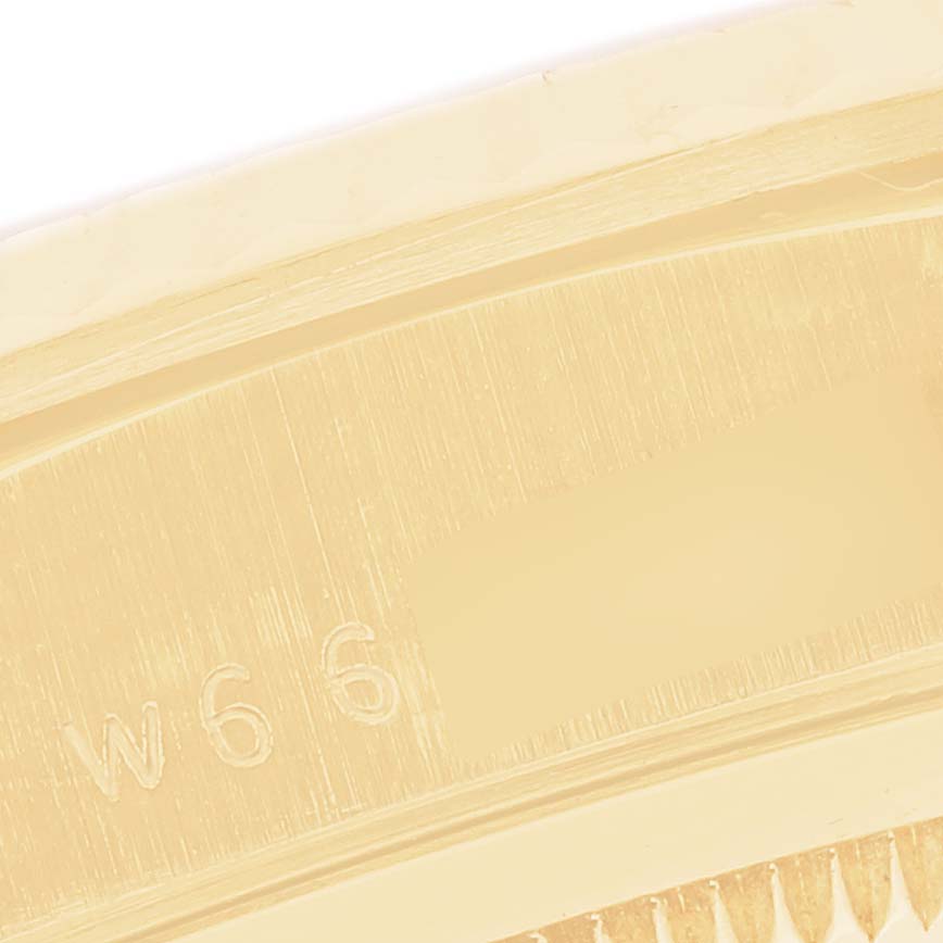 The image shows a close-up of the serial engraving on the edge of the Rolex President 18238 Men
s Yellow Gold Champagne Dial 18238 Men
s Yellow Gold Champagne Dial model watch.