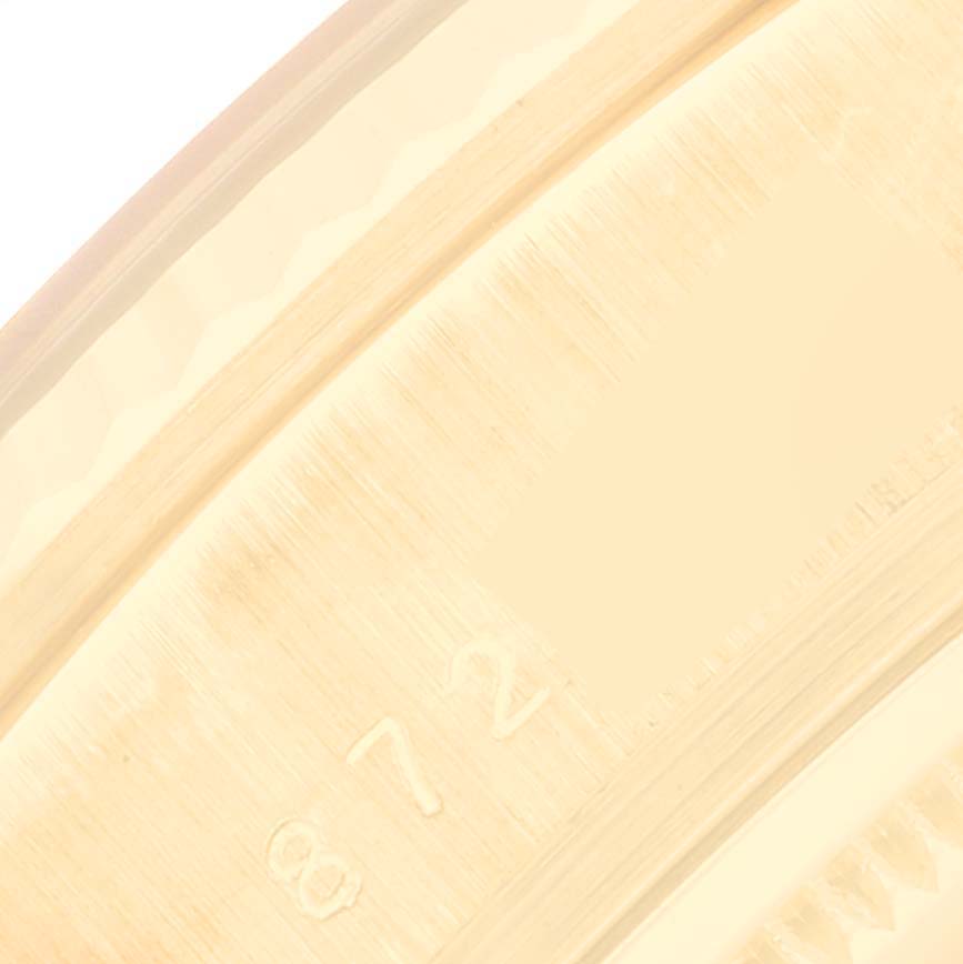 This image shows a close-up of the inner bezel of a Rolex President 18038 Men
s Yellow Gold Champagne Dial 18038 Men
s Yellow Gold Champagne Dial model watch, highlighting some engraved markings.