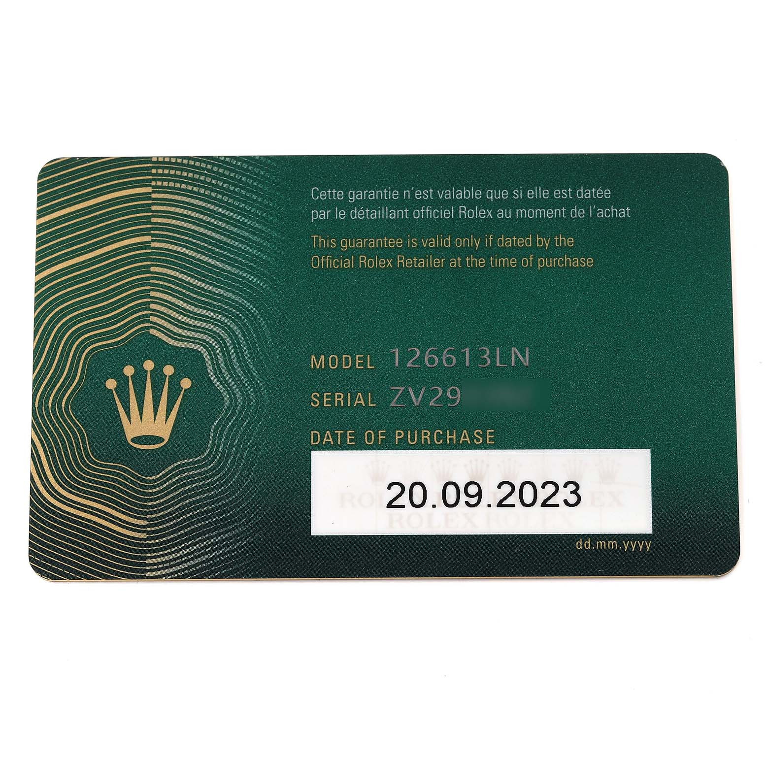 The image shows a warranty card for a Rolex Submariner 126613LN Men
s Steel and Gold (two tone) Black Dial 126613LN Men
s Steel and Gold (two tone) Black Dial model 126613LN.