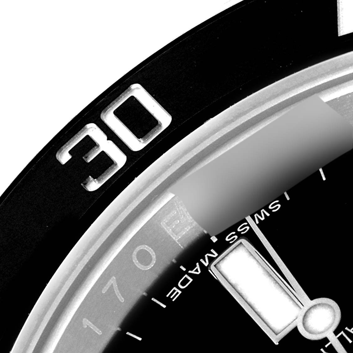 This close-up image shows the bezel and part of the dial of a Rolex Submariner 116610 Men's Stainless Steel Black Dial 116610 Men's Stainless Steel Black Dial watch, including the 30-minute marker.