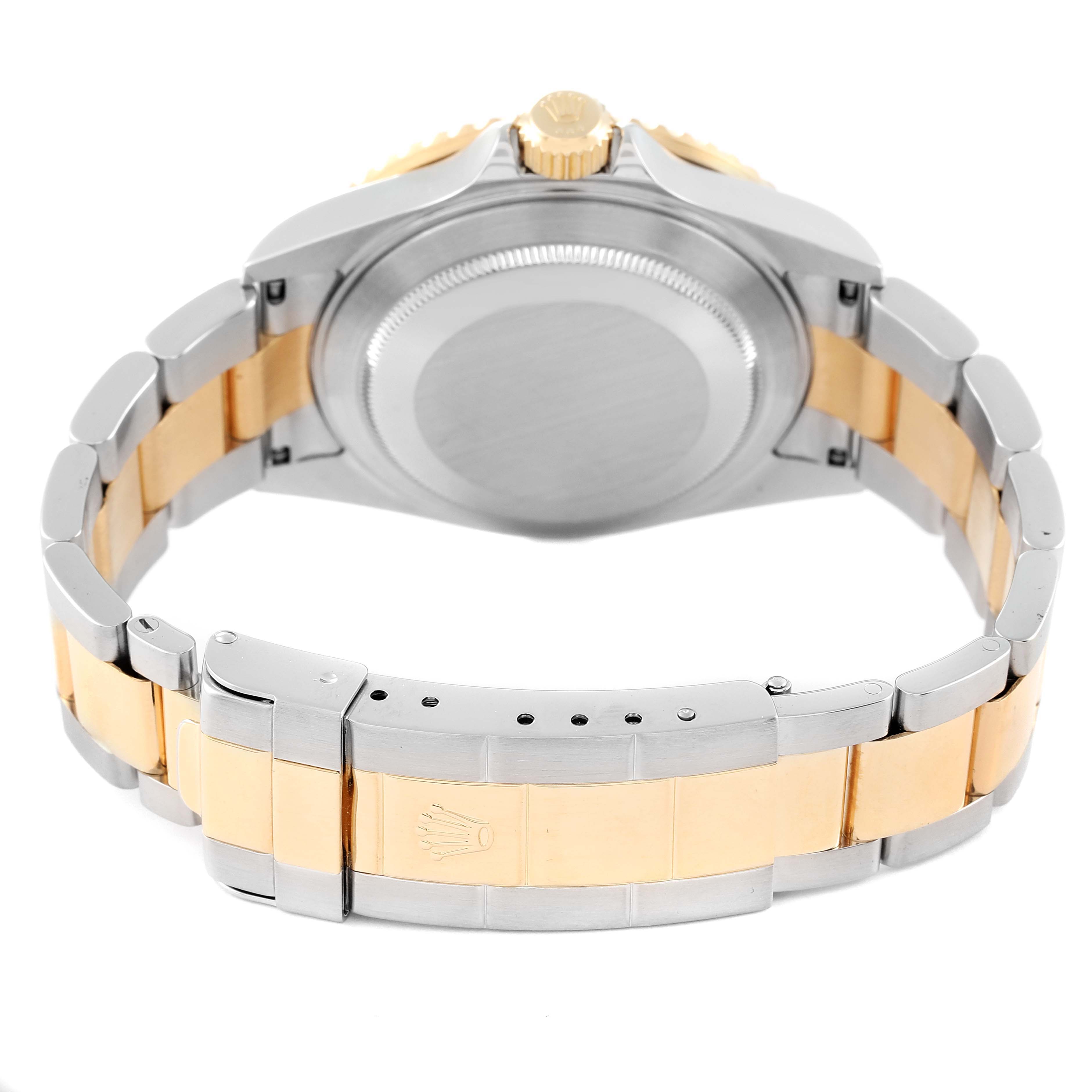 The image shows the back view of a Rolex Submariner 16613 Men's Steel and Gold (two tone) Blue Dial 16613 Men's Steel and Gold (two tone) Blue Dial watch, highlighting the case back, crown, and two-tone bracelet with the clasp.