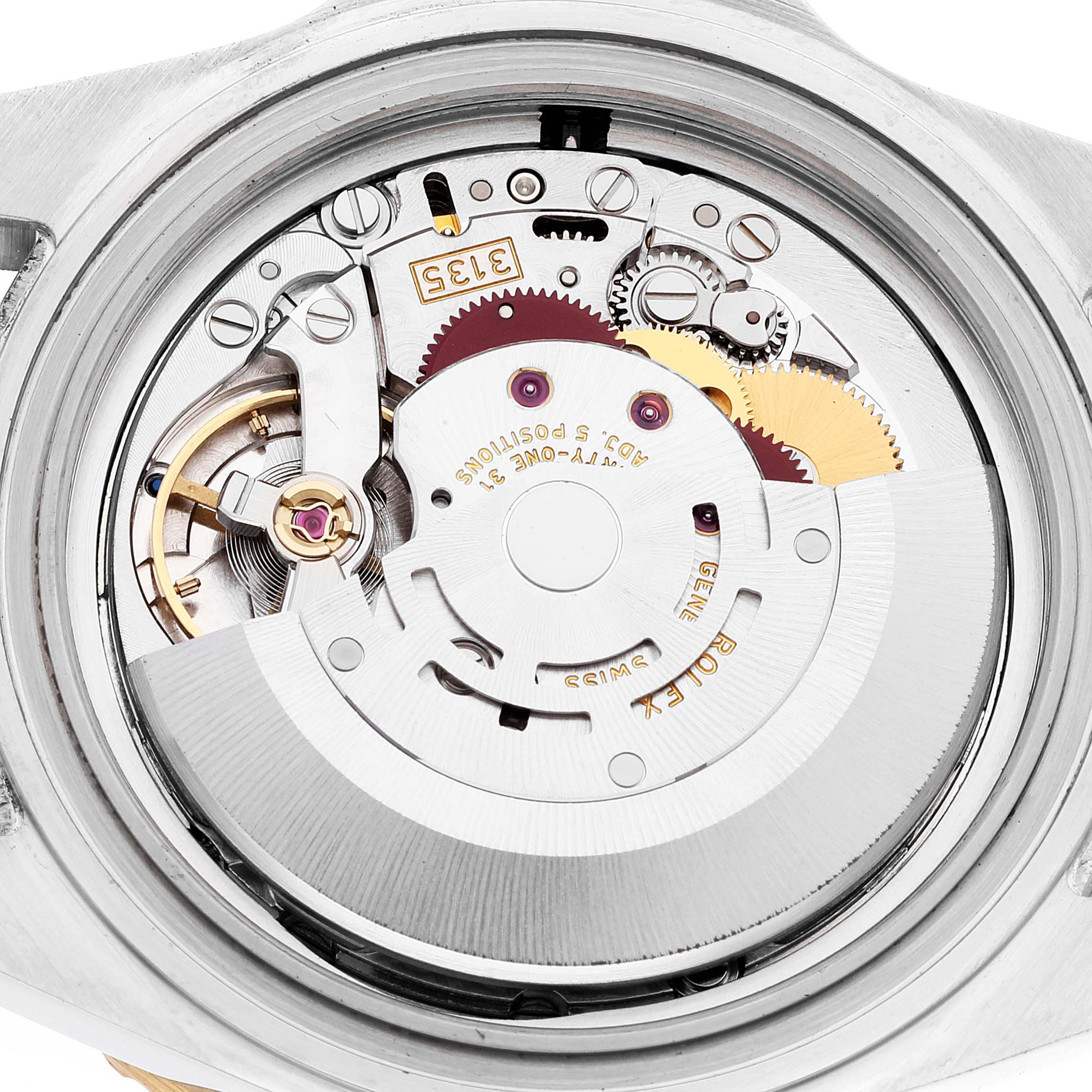 This image shows a close-up of the movement and internal parts of a Rolex Submariner 16613 Men's Steel and Gold (two tone) Blue Dial 16613 Men's Steel and Gold (two tone) Blue Dial watch.