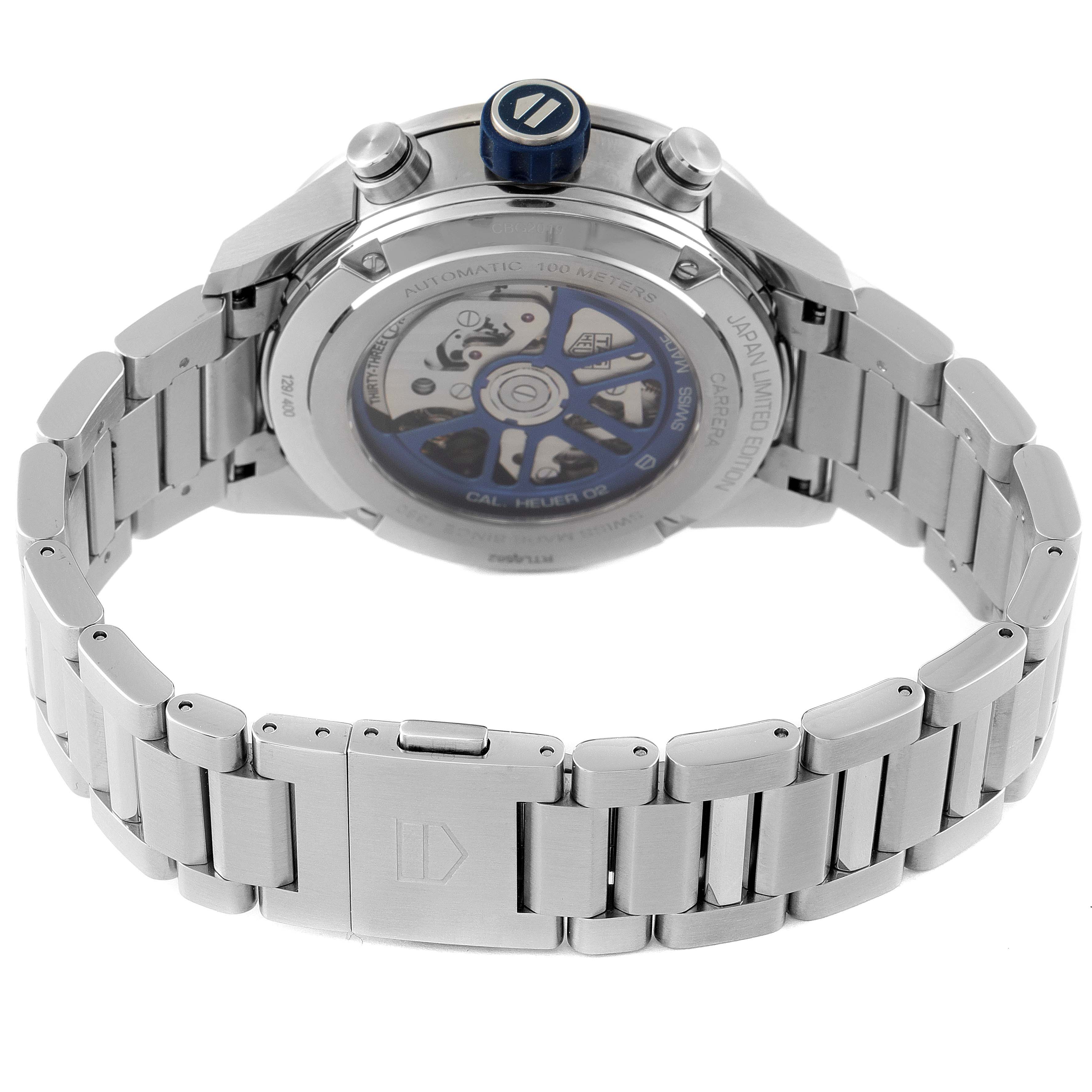 The image shows the back of the Tag Heuer Carrera watch, highlighting the movement and the stainless steel bracelet.
