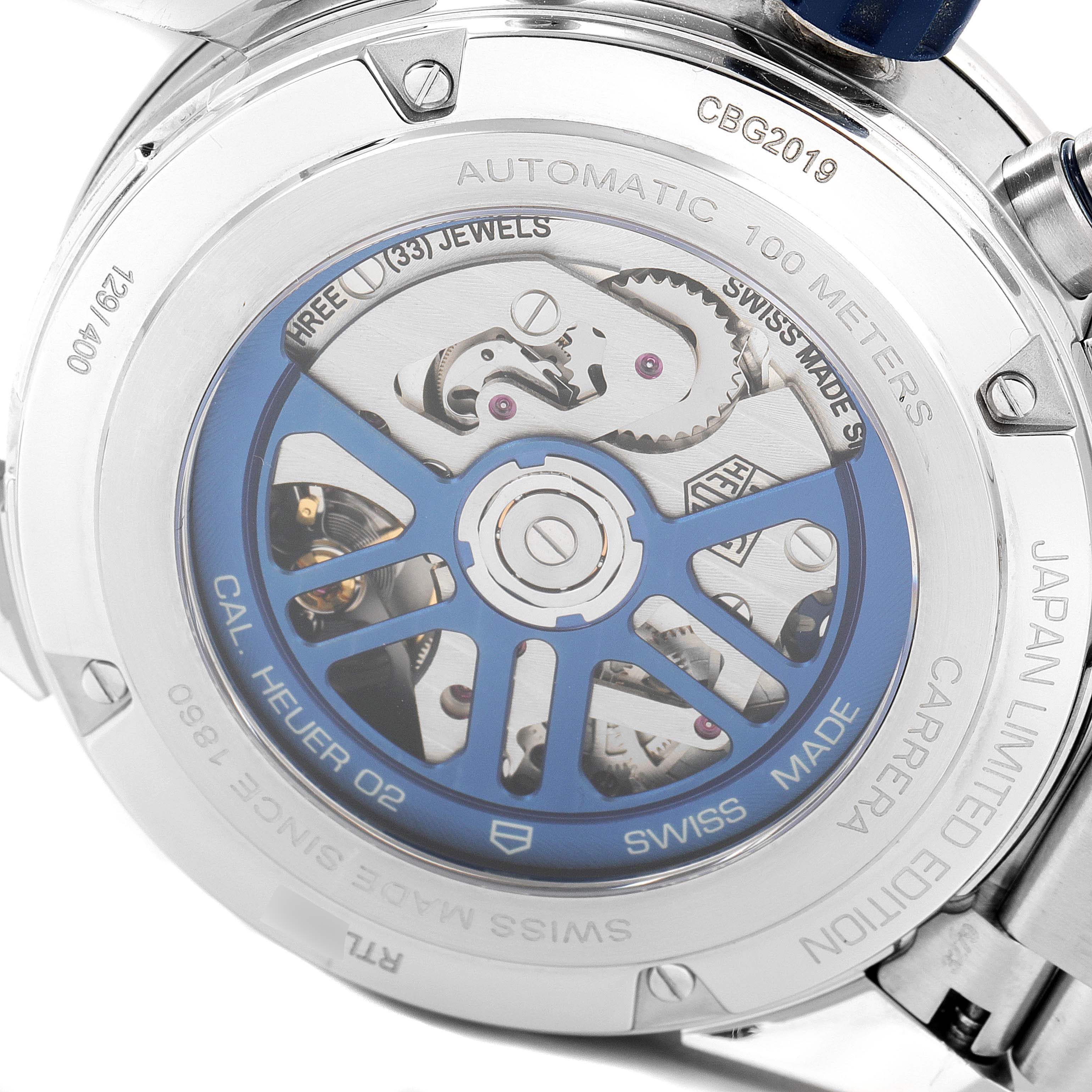 The image shows the back of a Tag Heuer Carrera watch, highlighting the automatic movement and inner mechanical parts.