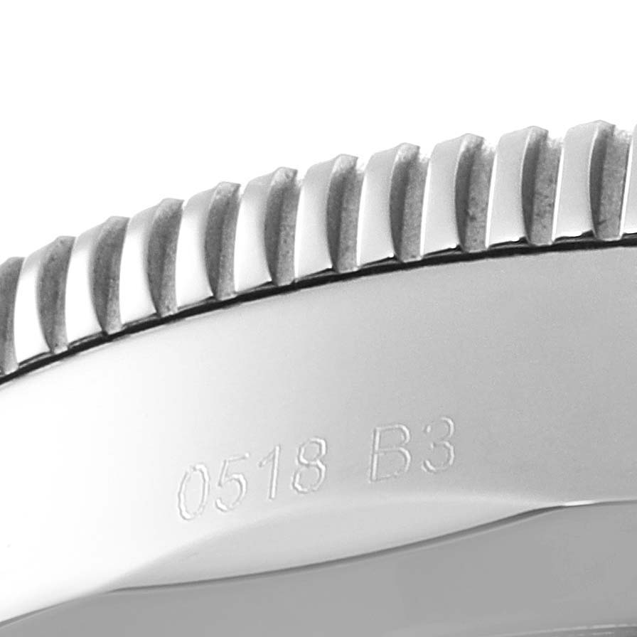 This close-up image shows the engraved edge and ridged bezel of the Breitling Superocean AB202016-C961-152A Men's Stainless Steel Black Dial AB202016-C961-152A Men's Stainless Steel Black Dial watch.