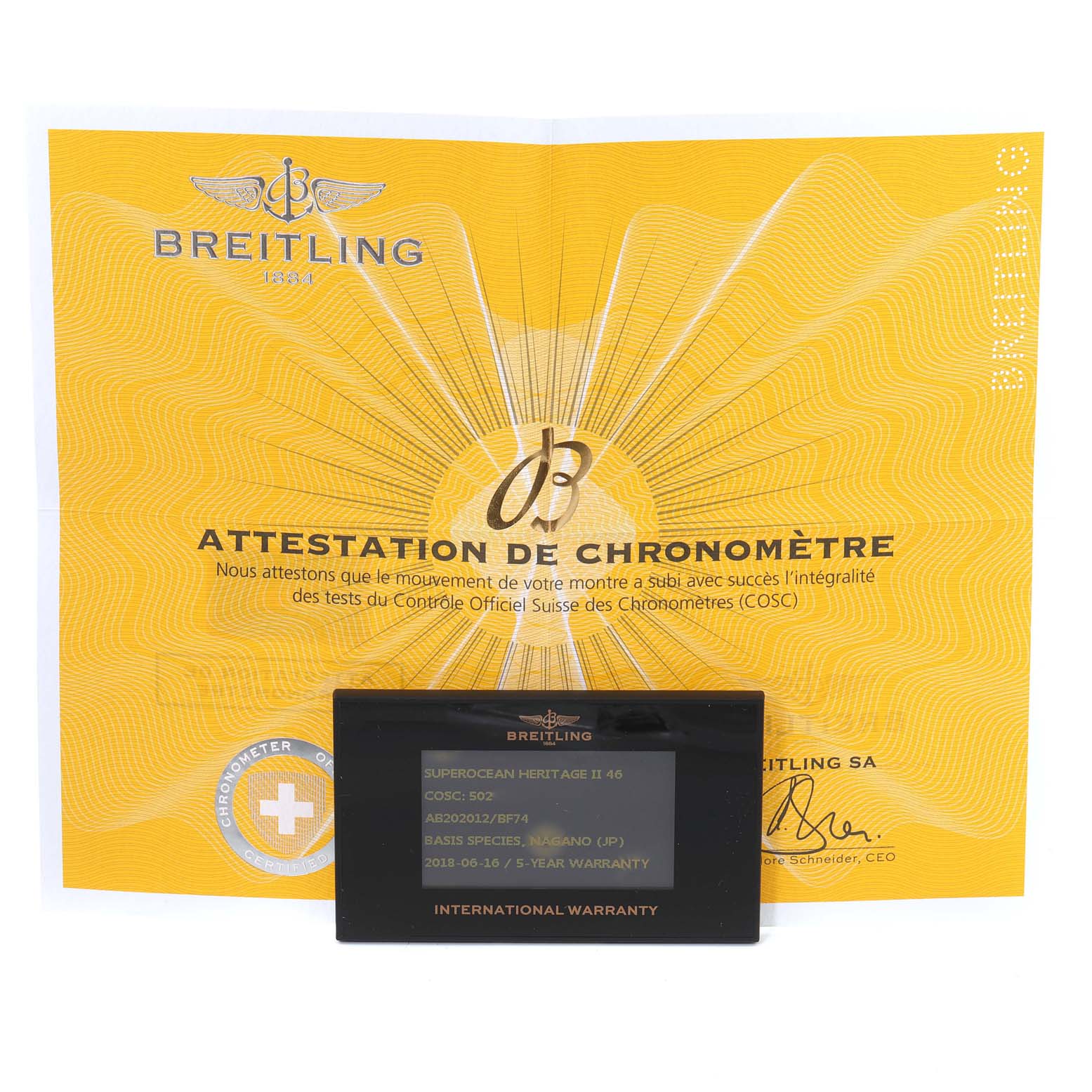 The image shows the warranty card and chronometer certificate for a Breitling Superocean AB202016-C961-152A Men's Stainless Steel Black Dial AB202016-C961-152A Men's Stainless Steel Black Dial model watch, taken from a top view.