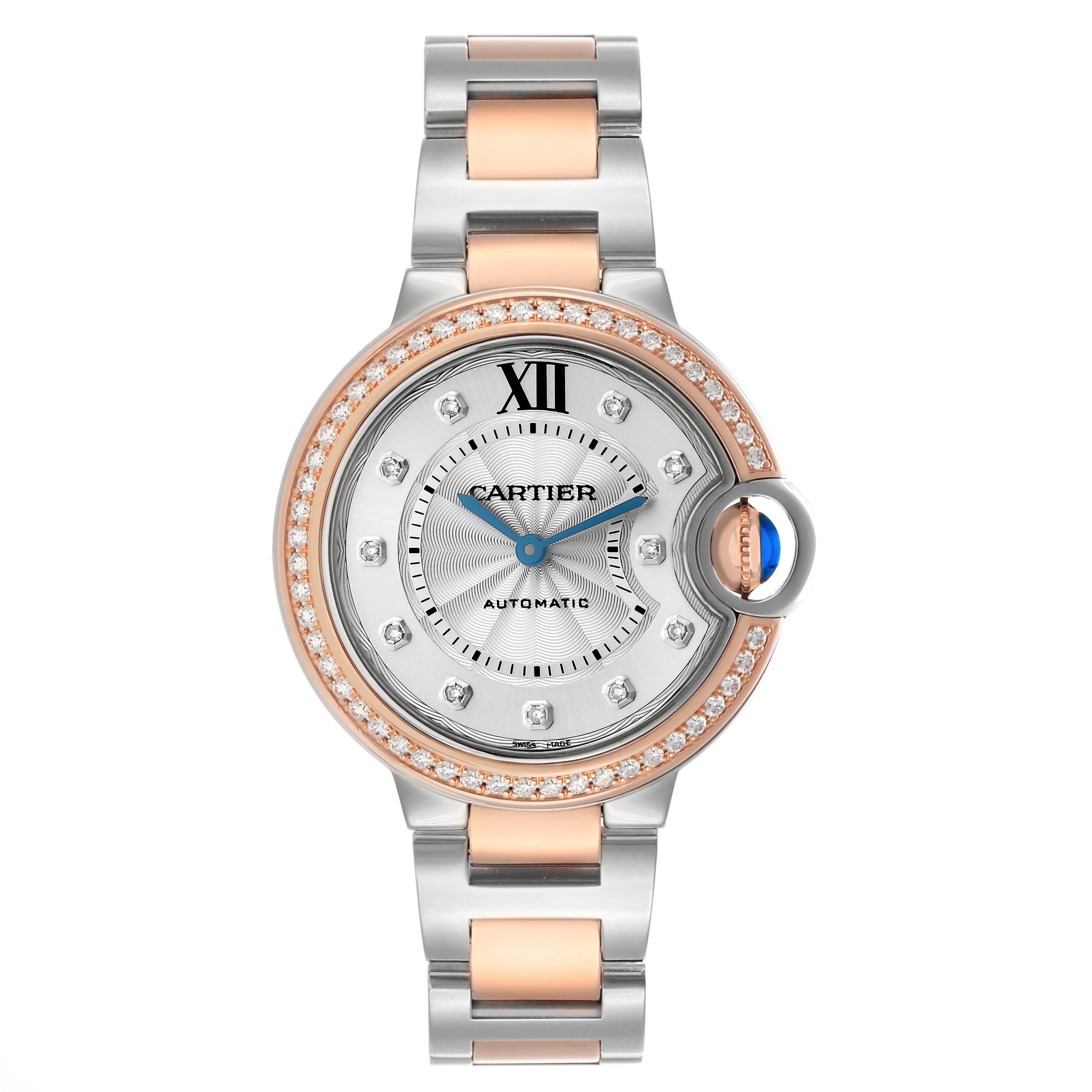 The image shows the Cartier Ballon Bleu W3BB0023 Women's Steel and Gold (two tone) Silver Dial watch from a top-down angle, highlighting its dial, bracelet, and bejeweled bezel.