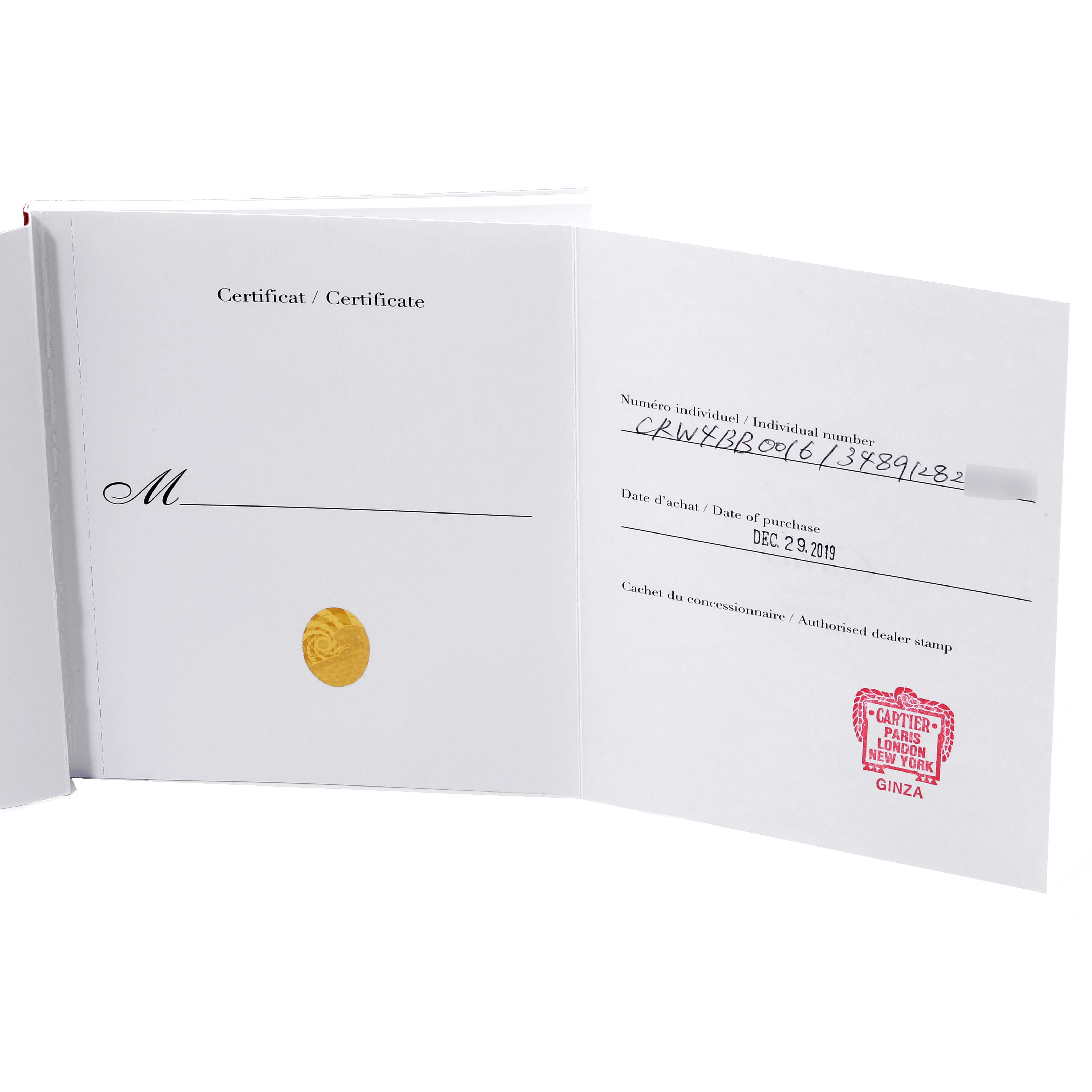 The image shows an opened certificate booklet for a Ballon Bleu model by Cartier, displaying the purchase details.