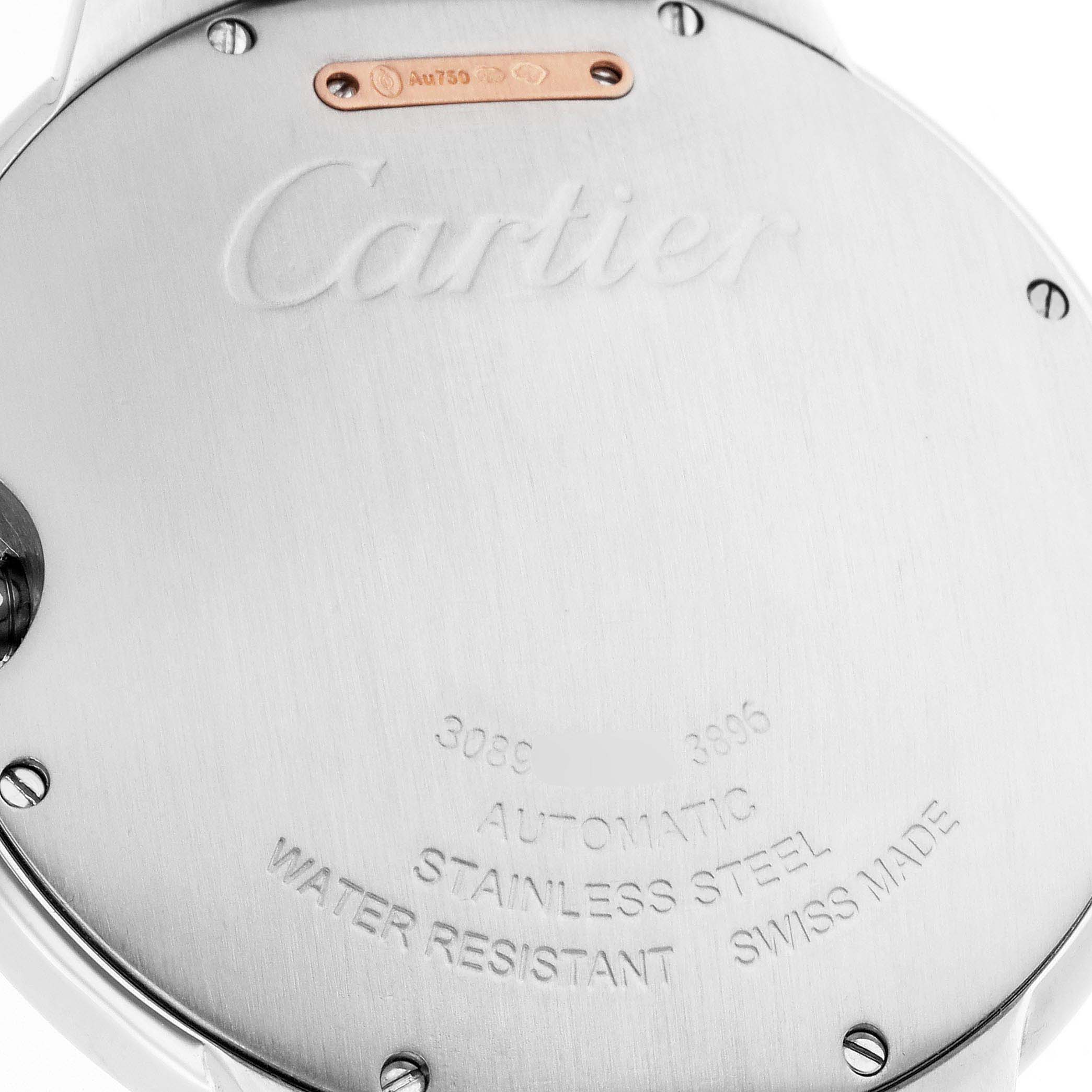 The image shows the back of a Cartier Ballon Bleu W2BB0004 Men's Steel and Gold (two tone) Silver Dial watch, highlighting engravings and screws.