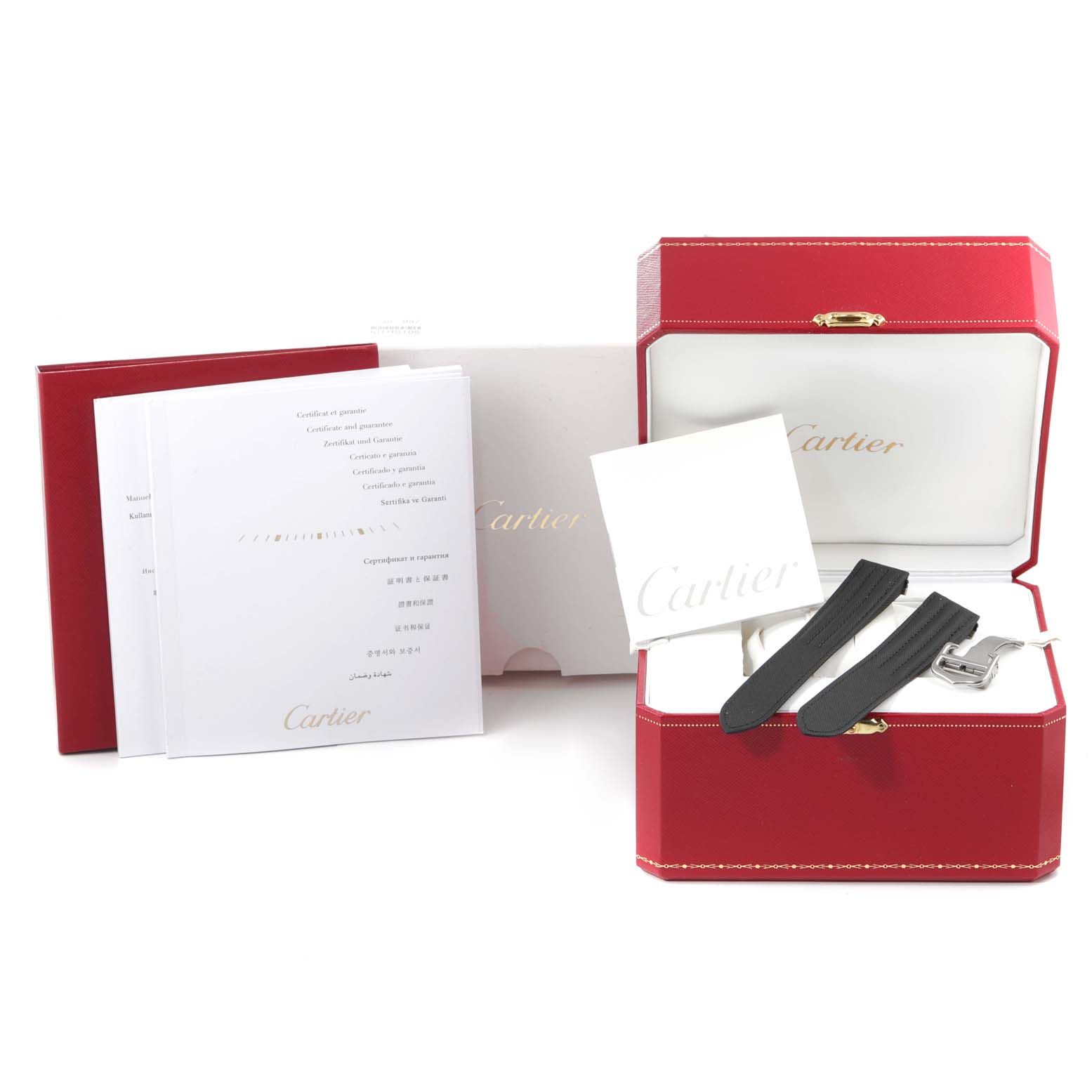 The image shows a Cartier Roadster W62019X6 Men
s Stainless Steel Silver Dial W62019X6 Men
s Stainless Steel Silver Dial model watch box, additional straps, and accompanying documentation from a front angle.