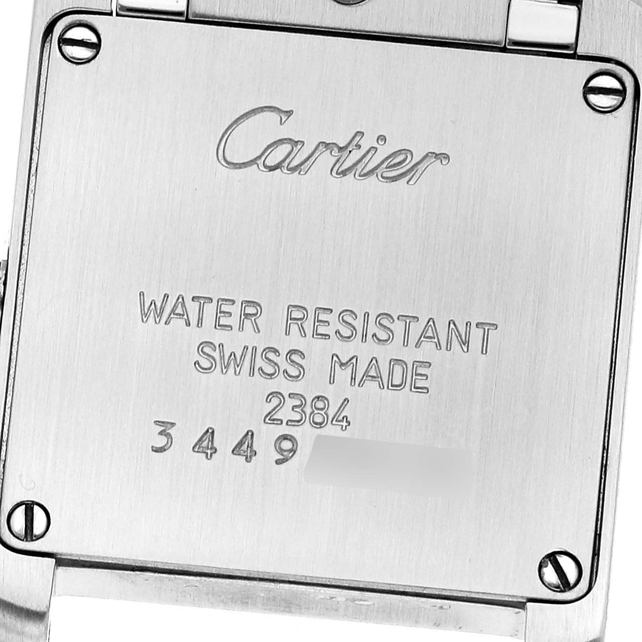 This image shows the back of a Cartier Tank Francaise W51007Q4 Women
s Steel and Gold (two tone) Silver Dial W51007Q4 Women
s Steel and Gold (two tone) Silver Dial watch, displaying the brand, water resistance, "Swiss Made," and serial number.