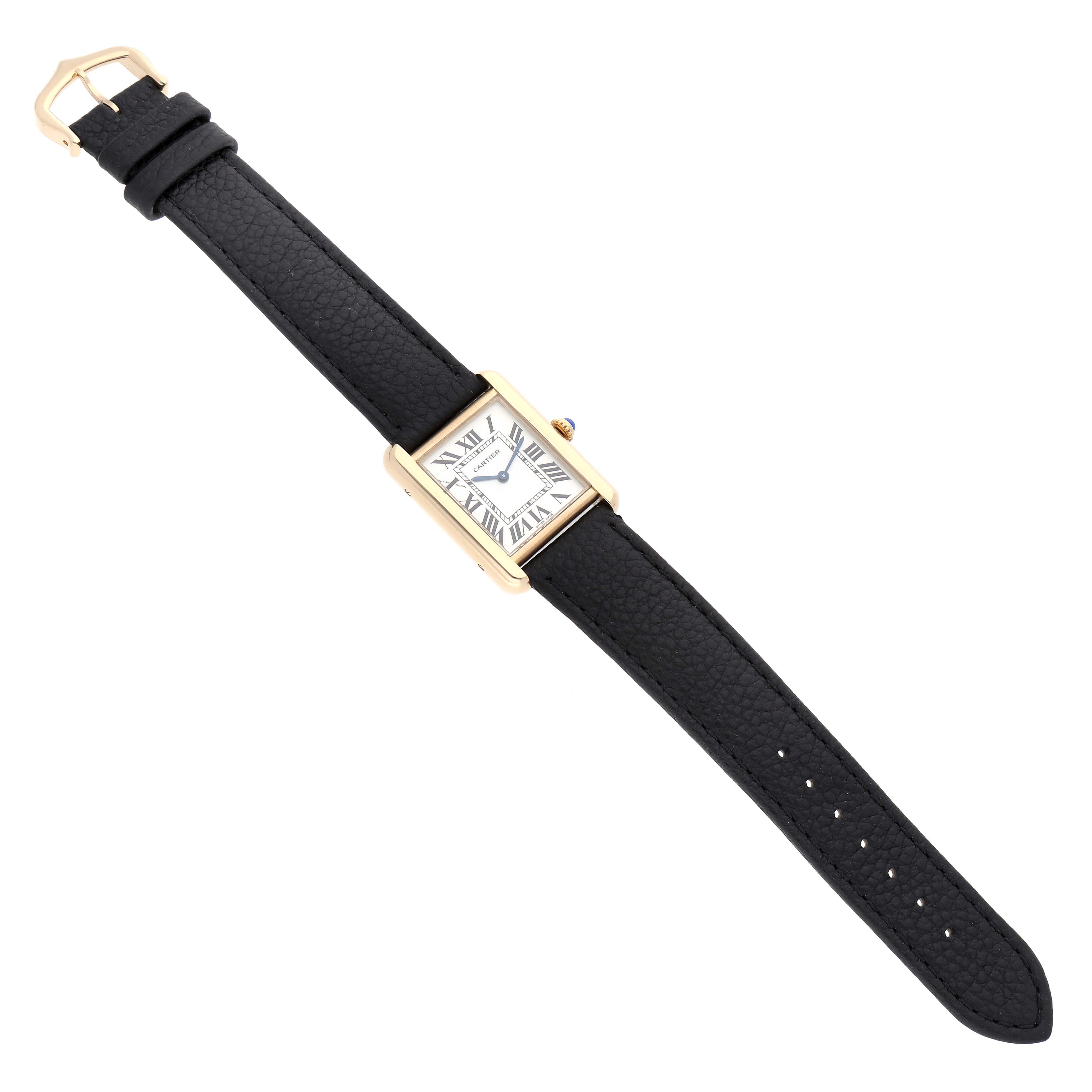 The Cartier Tank Solo W5200002 Women's Yellow Gold Silver Dial watch is shown in a full-length, top-down view, highlighting its black strap and rectangular face.