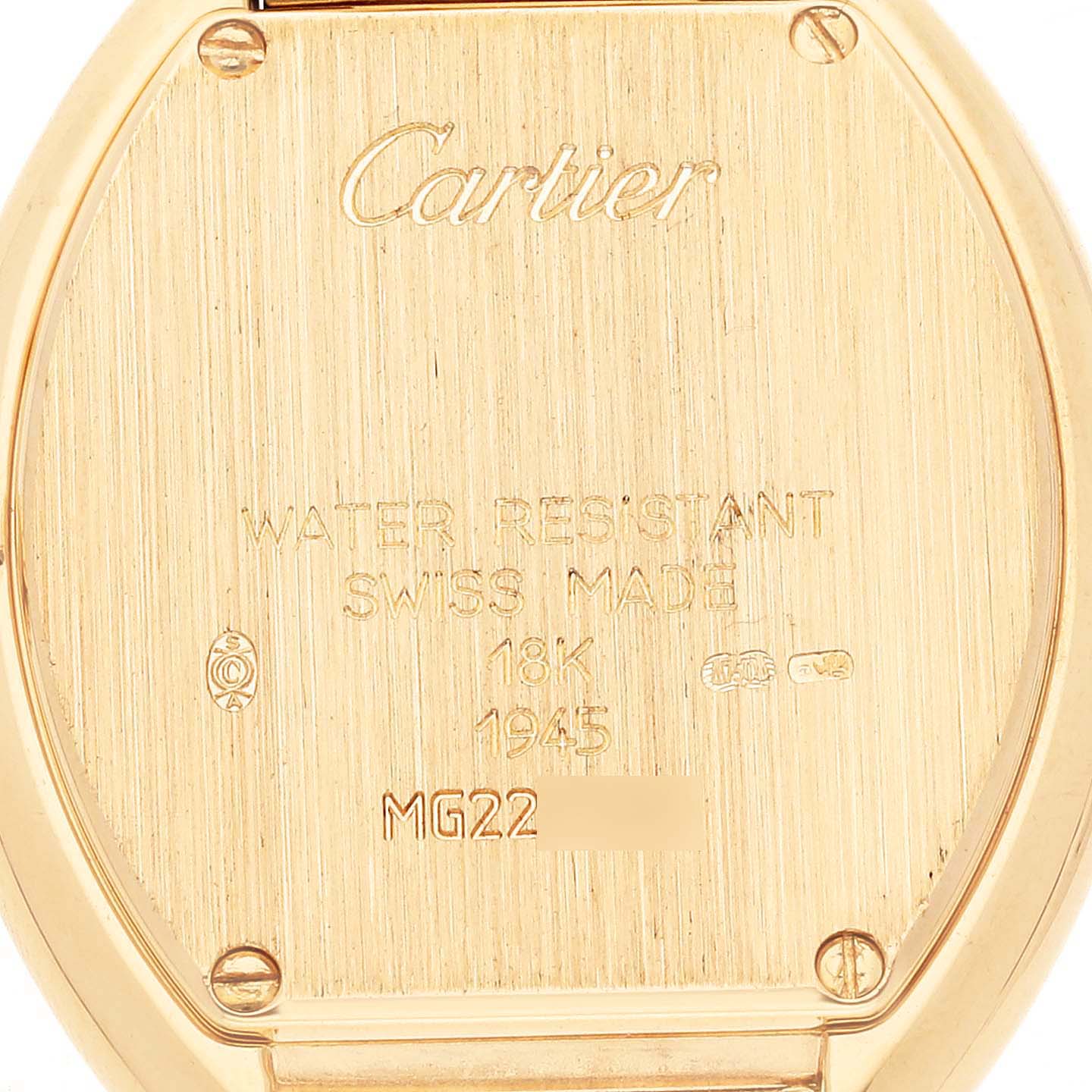 The image shows the back case of a Cartier Tonneau W15174P4 Women's Yellow Gold Silver Dial W15174P4 Women's Yellow Gold Silver Dial model watch, highlighting its inscriptions and markings.