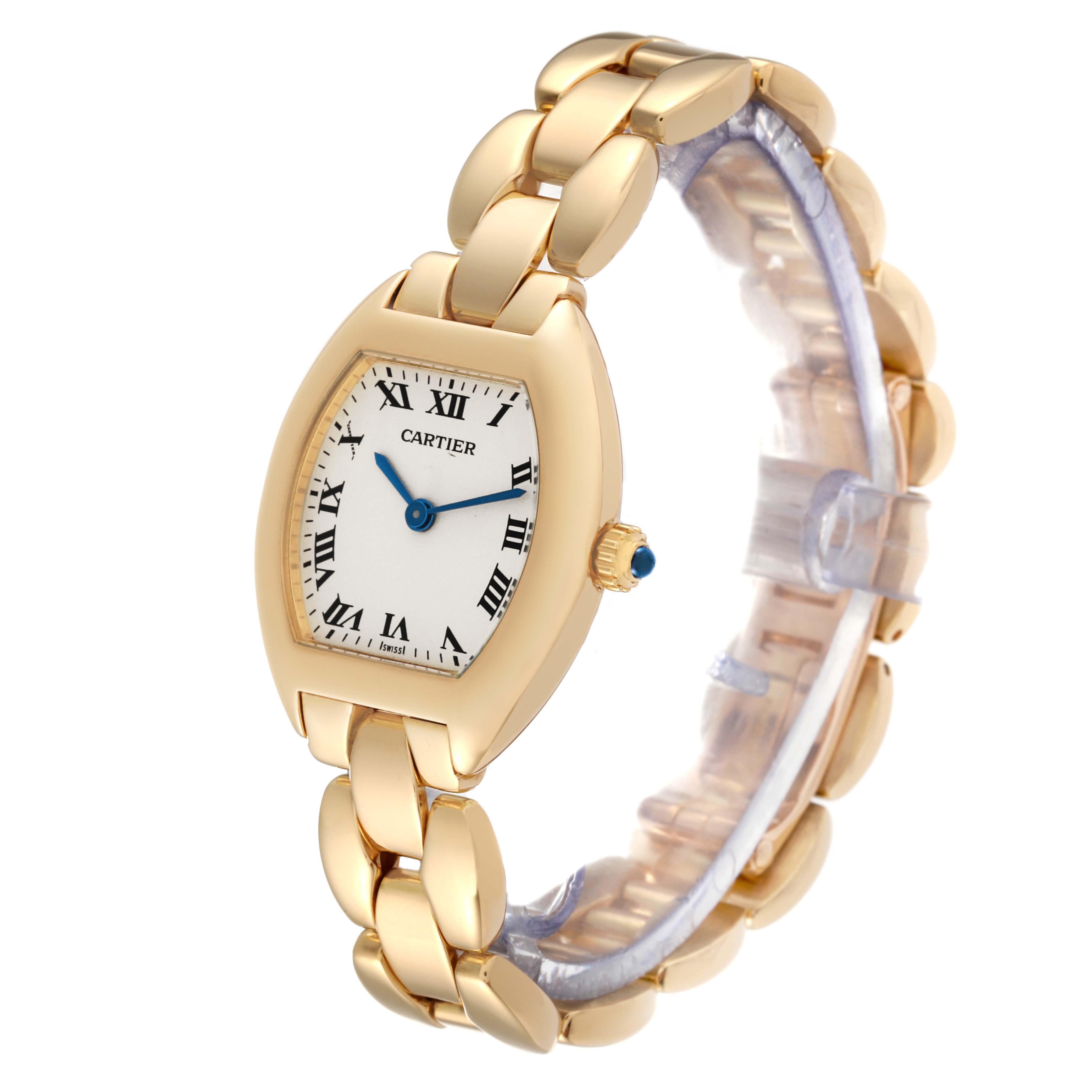The Cartier Tonneau W15174P4 Women's Yellow Gold Silver Dial W15174P4 Women's Yellow Gold Silver Dial watch is shown at a slight angle view, highlighting its gold casing and bracelet, Roman numeral dial, and blue hands.