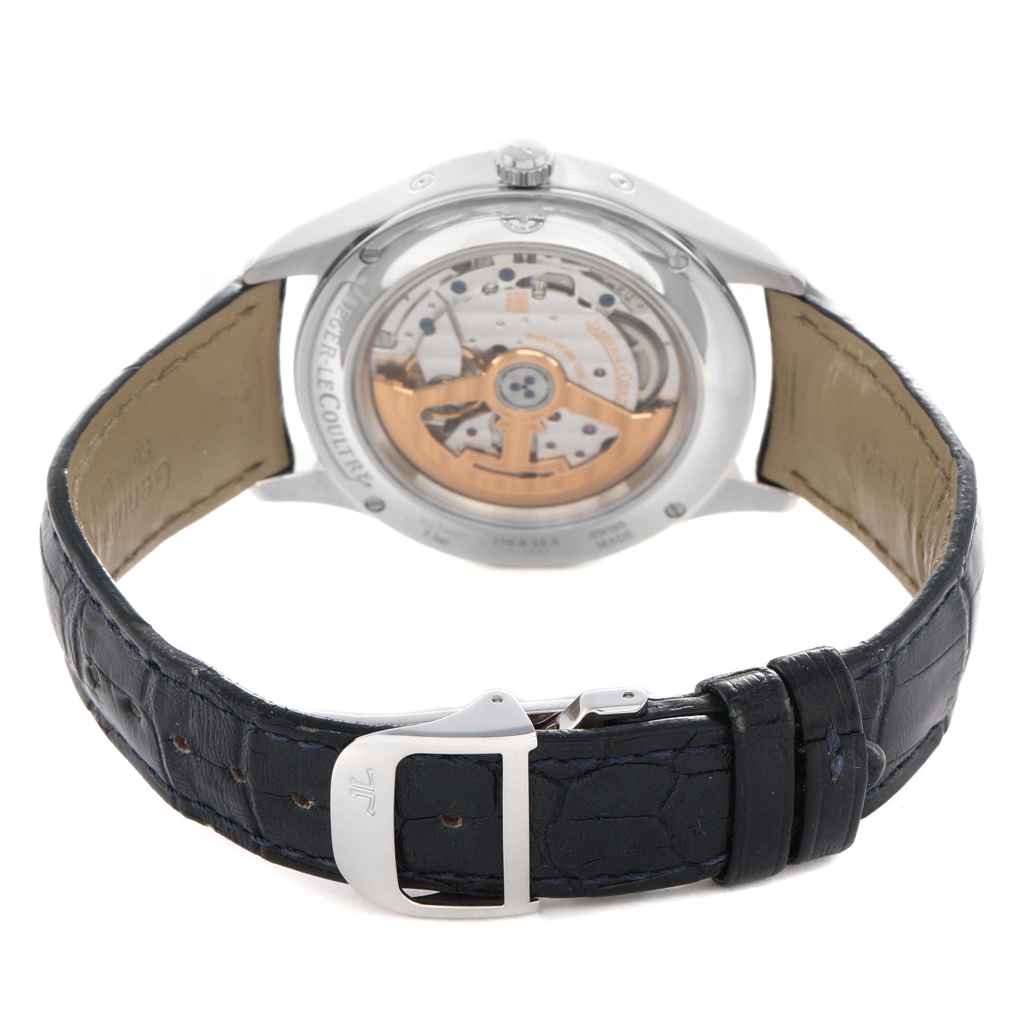 The Jaeger-LeCoultre Master watch is shown from the back, highlighting its transparent caseback and visible movement.