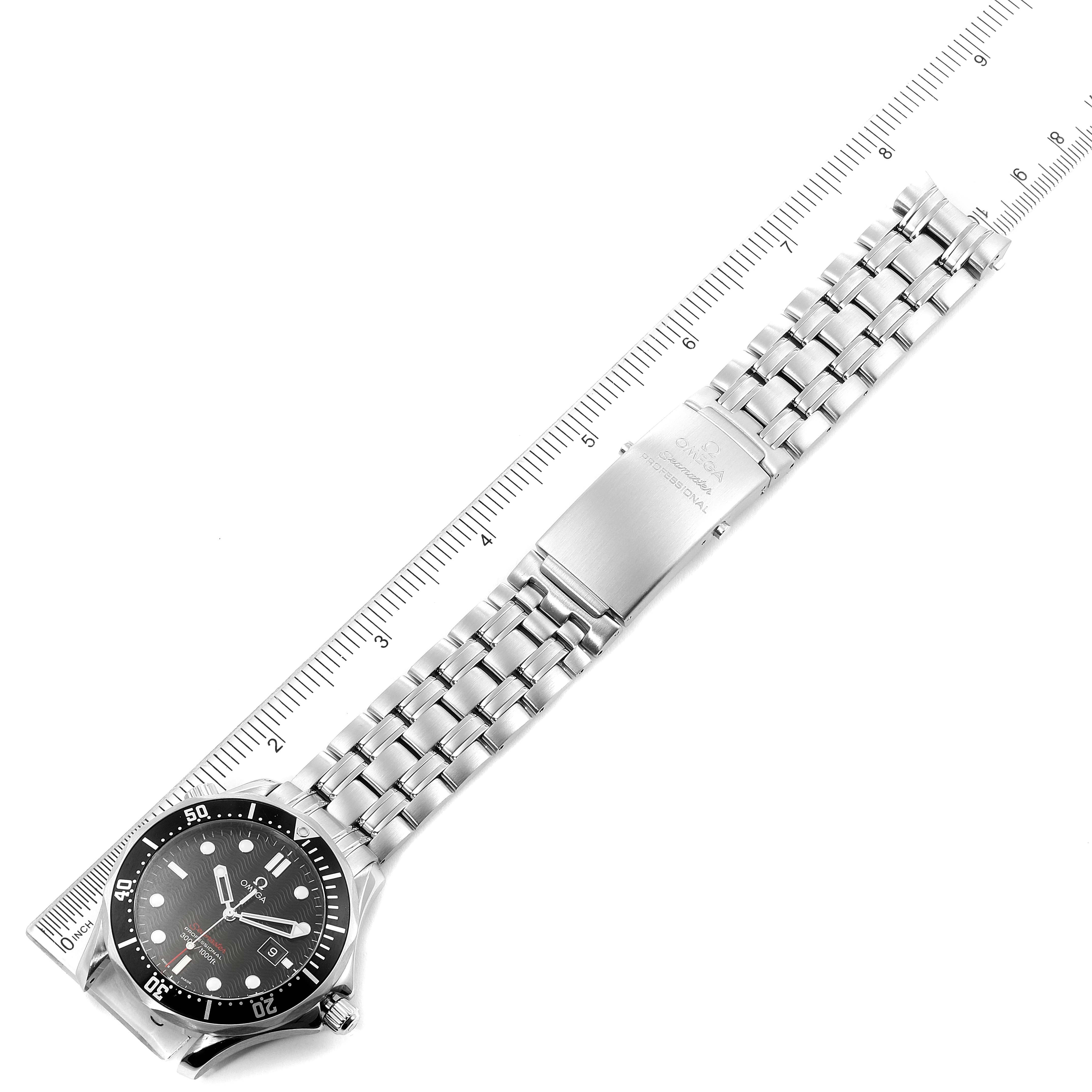 The image shows a top-down view of an Omega Seamaster 212.30.41.61.01.001 Men's Stainless Steel Black Dial 212.30.41.61.01.001 Men's Stainless Steel Black Dial watch, displaying its face, bezel, and full metal bracelet alongside a ruler.