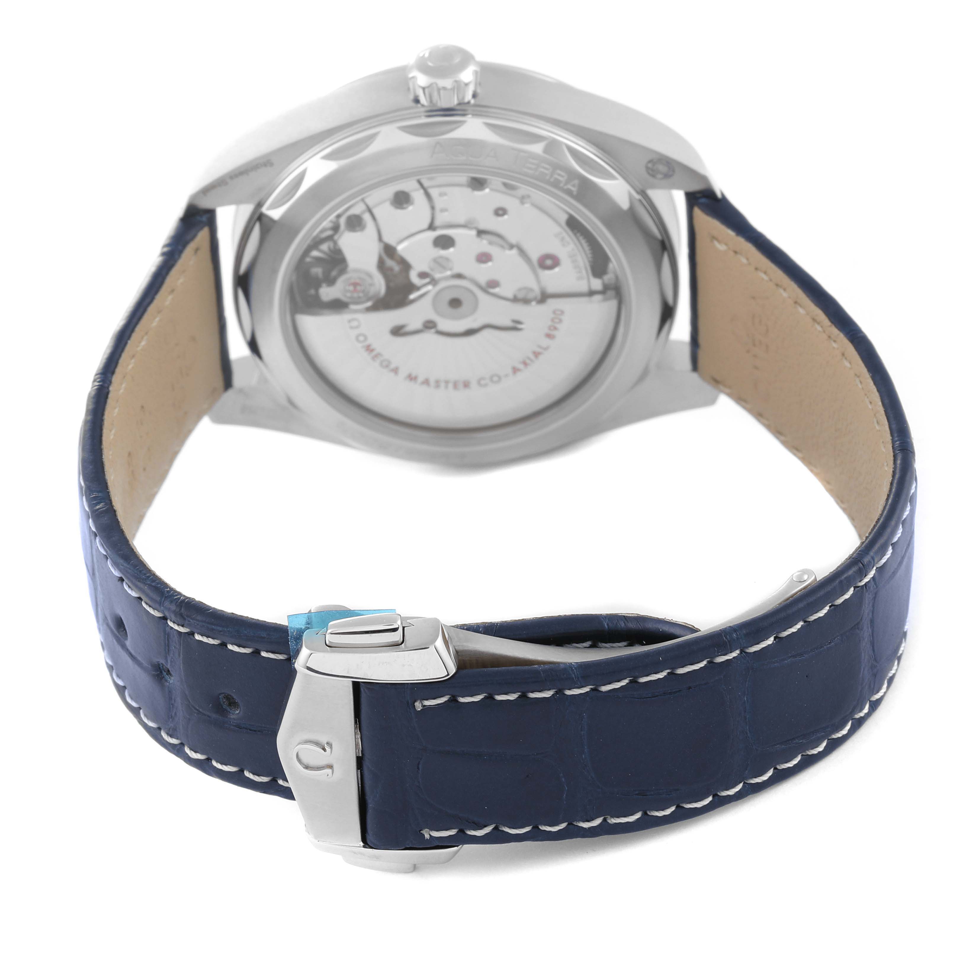 The image shows the back view of the Omega Aqua Terra 220.13.41.21.03.002 Men
s Stainless Steel Blue Dial 220.13.41.21.03.002 Men
s Stainless Steel Blue Dial watch, highlighting the movement and blue leather strap with a clasp.