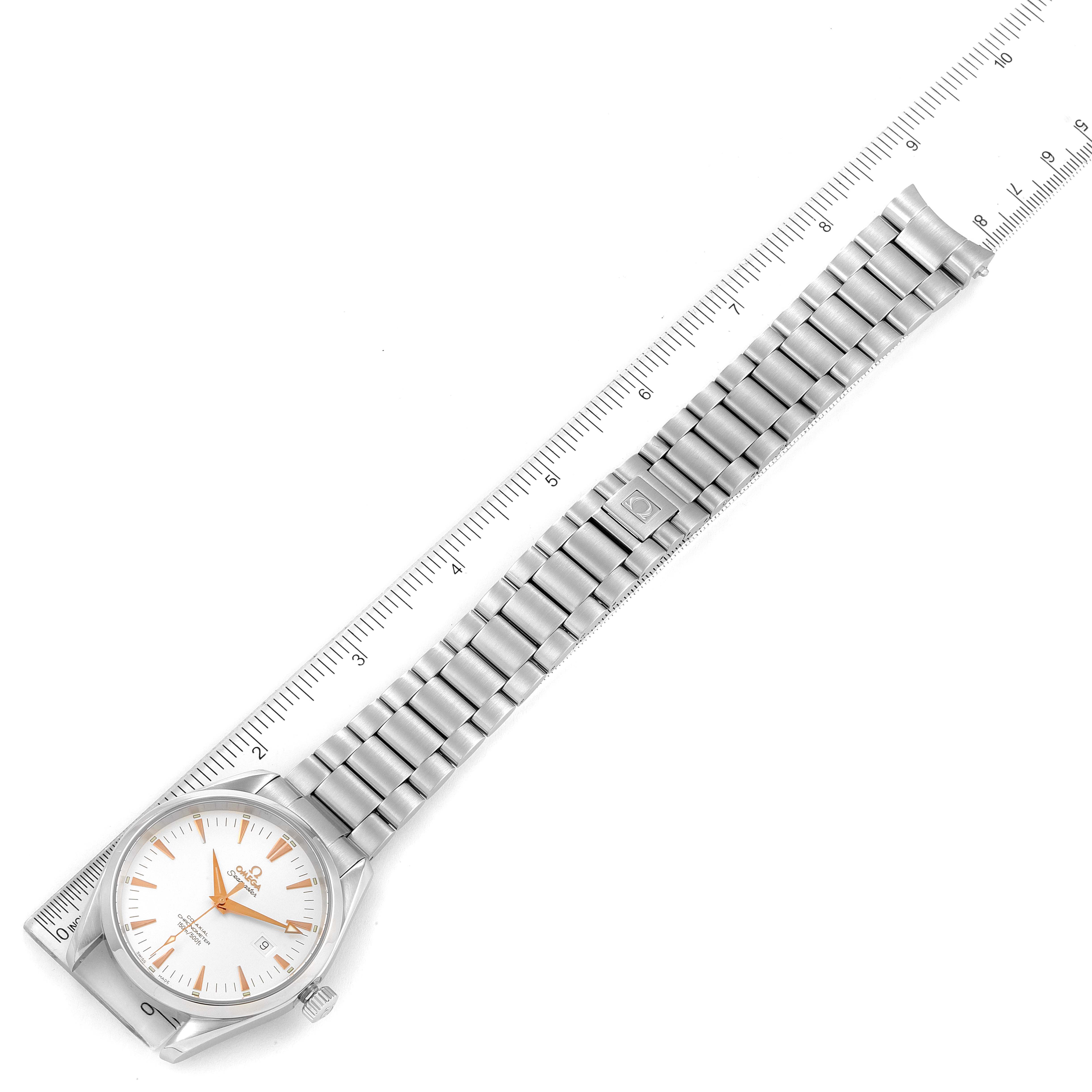 The image shows an Omega Aqua Terra 2502.34.00 Men's Stainless Steel Silver Dial 2502.34.00 Men's Stainless Steel Silver Dial watch laid flat with its face, bracelet, and clasp visible, alongside a ruler for scale.