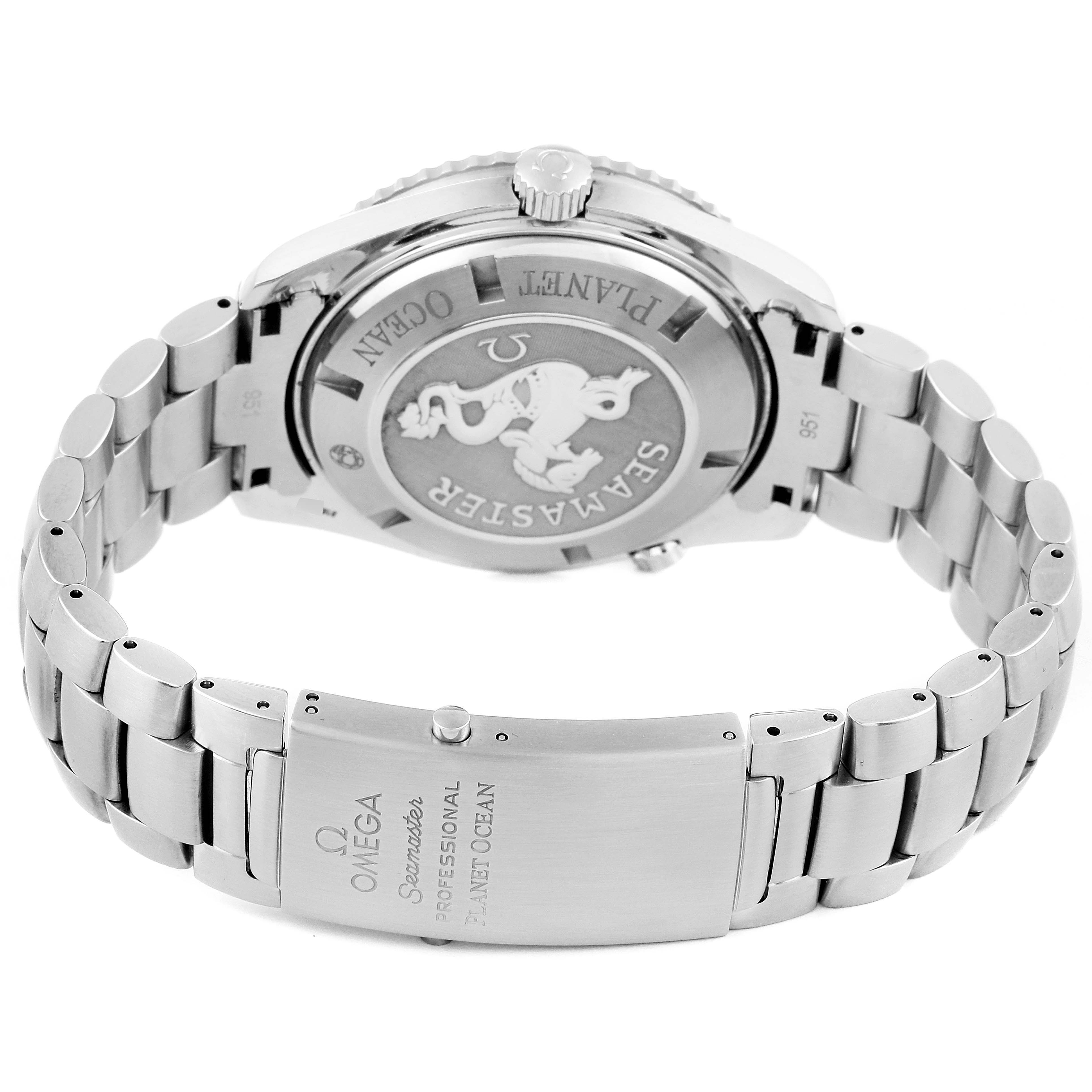 The image shows the back and bracelet of the Omega Seamaster Planet Ocean watch, highlighting the case back and clasp.