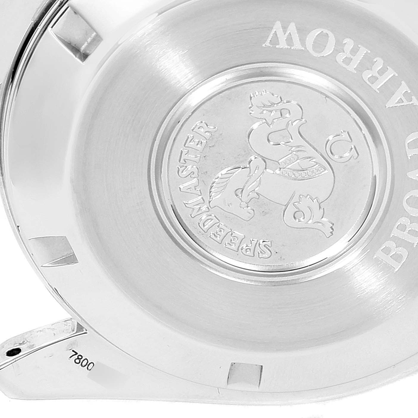 This image shows the case back of the Omega Speedmaster 3551.50.00 Men
s Stainless Steel Black Dial 3551.50.00 Men
s Stainless Steel Black Dial watch with an engraved logo and part of the bracelet.