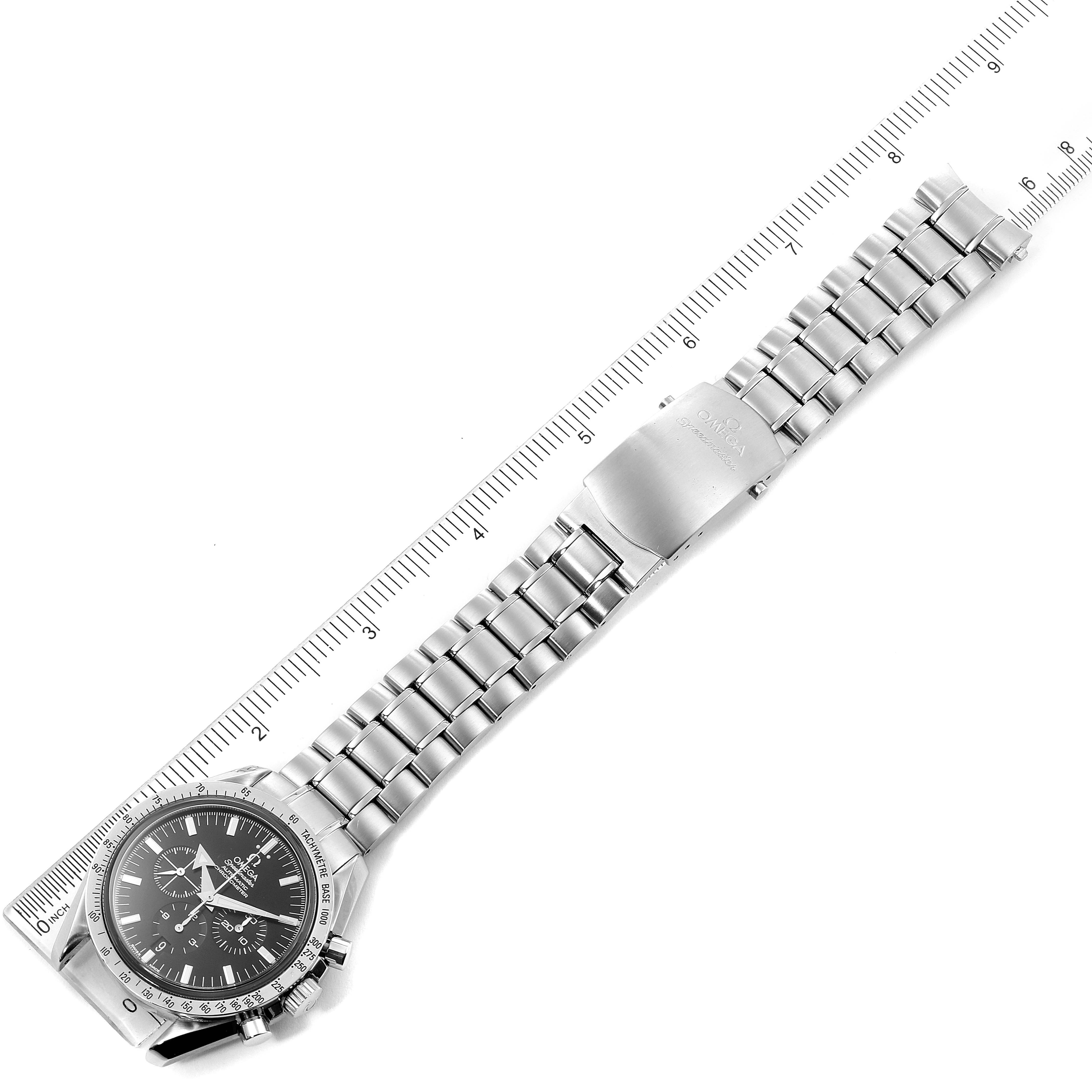 The image shows an overhead view of an Omega Speedmaster 3551.50.00 Men
s Stainless Steel Black Dial 3551.50.00 Men
s Stainless Steel Black Dial watch, displaying its face and metal bracelet alongside a ruler for scale.