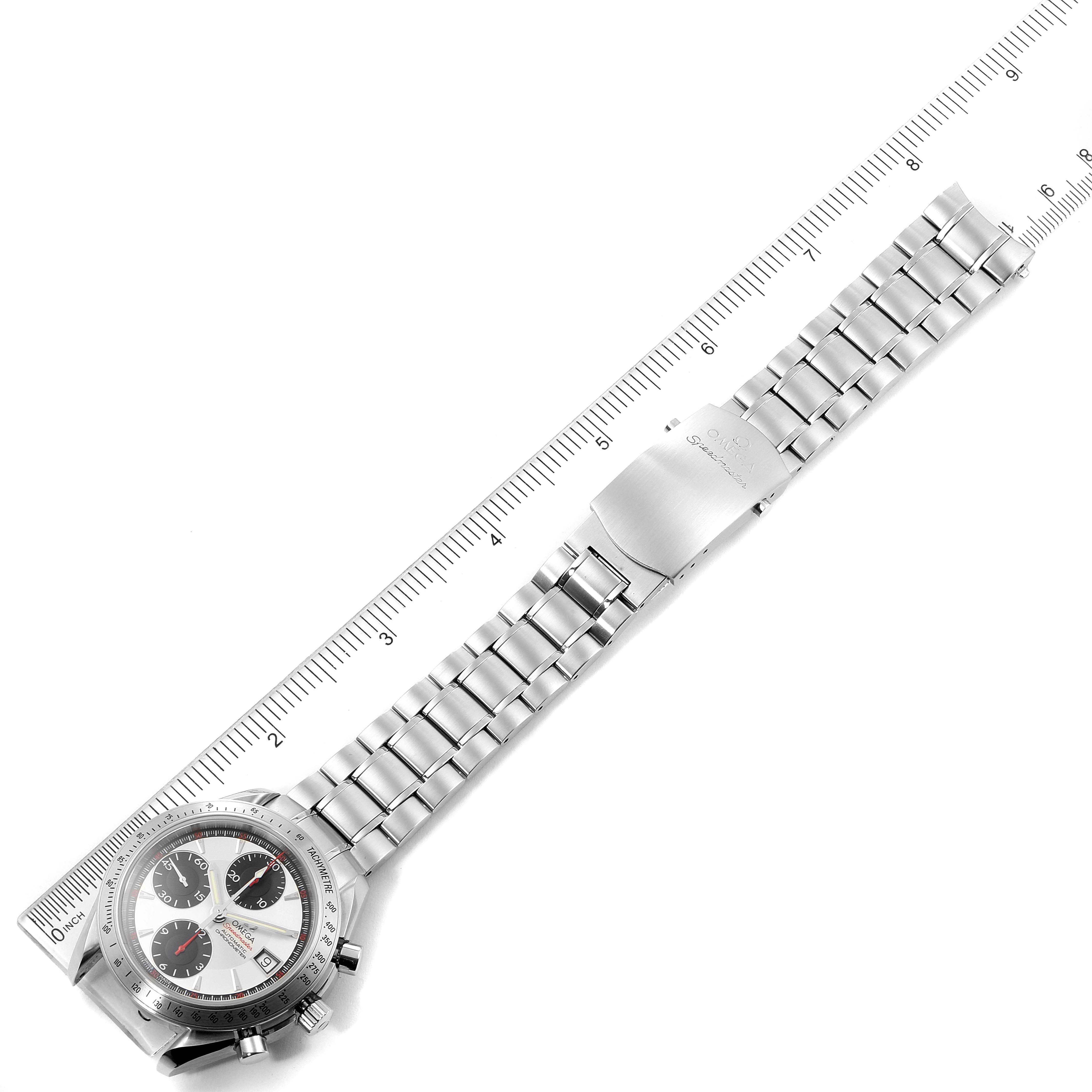 The image shows an Omega Speedmaster 3211.31.00 Men's Stainless Steel Silver Dial 3211.31.00 Men's Stainless Steel Silver Dial watch laid flat, displaying the watch face, bracelet, and clasp alongside a ruler for scale.