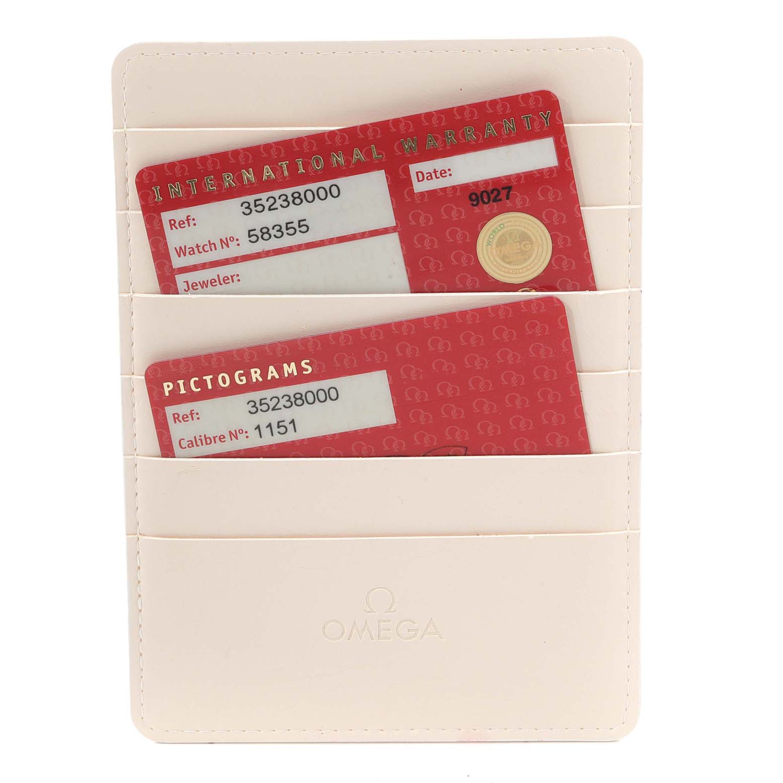 The image shows warranty and pictogram cards for an Omega Speedmaster 3523.80.00 Men
s Stainless Steel Blue Dial 3523.80.00 Men
s Stainless Steel Blue Dial, held in a white Omega-branded cardholder.