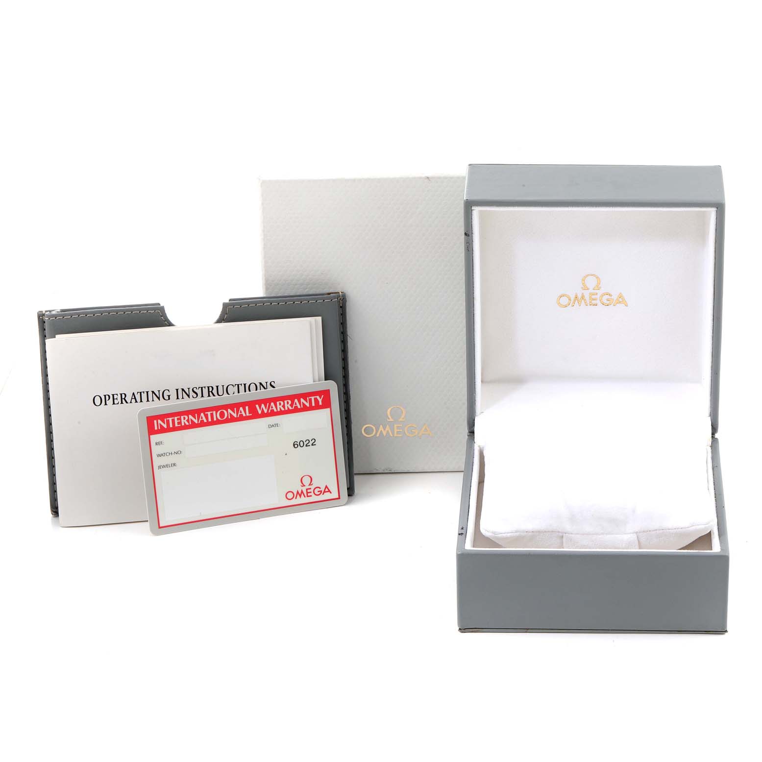 The image shows an Omega Speedmaster 3521.30.00 Men
s Stainless Steel Silver Dial 3521.30.00 Men
s Stainless Steel Silver Dial watch box with operating instructions and an international warranty card.