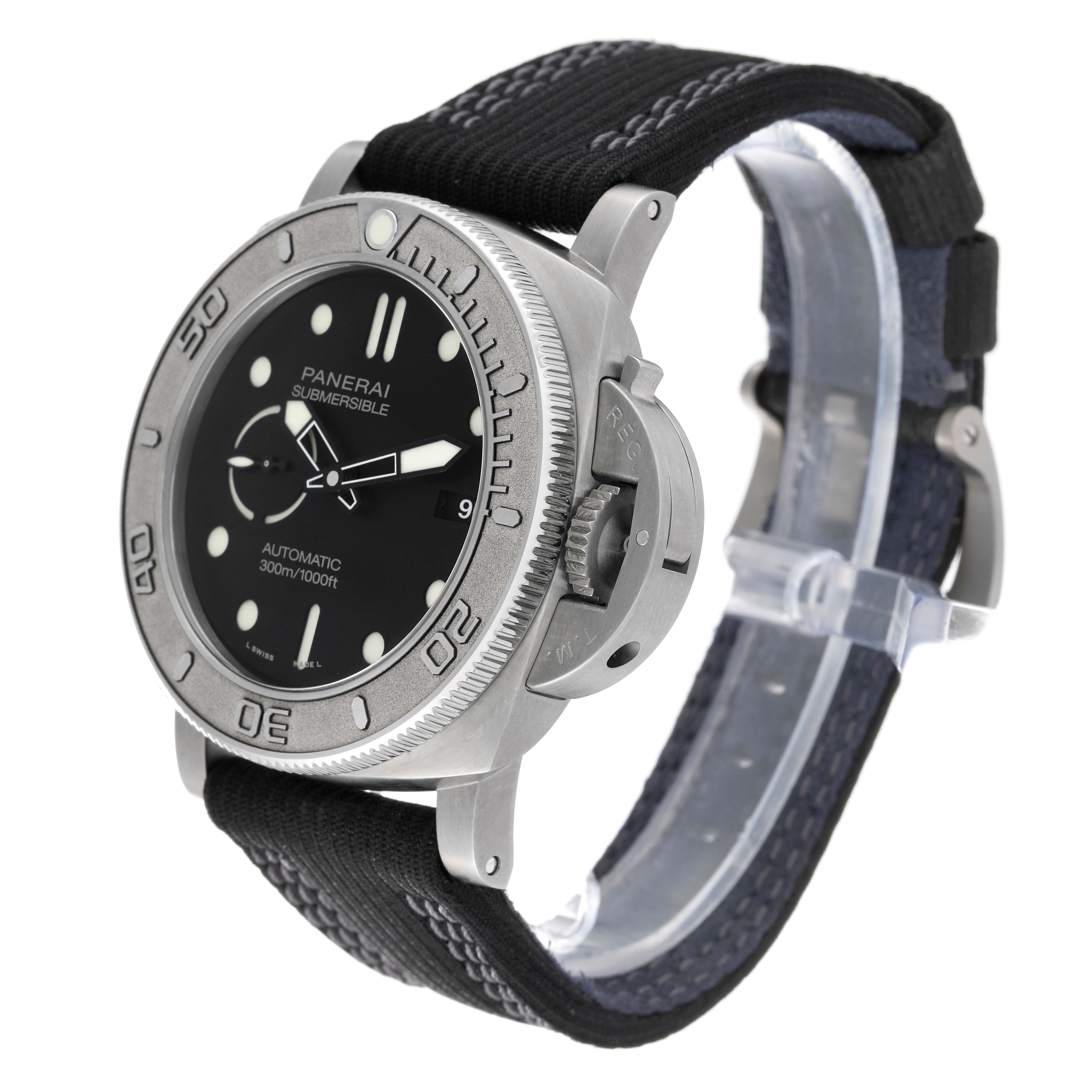 The Panerai Submersible PAM00984 Men's Titanium Black Dial PAM00984 Men's Titanium Black Dial watch is shown from a slight side angle, highlighting the face, bezel, strap, and crown guard.