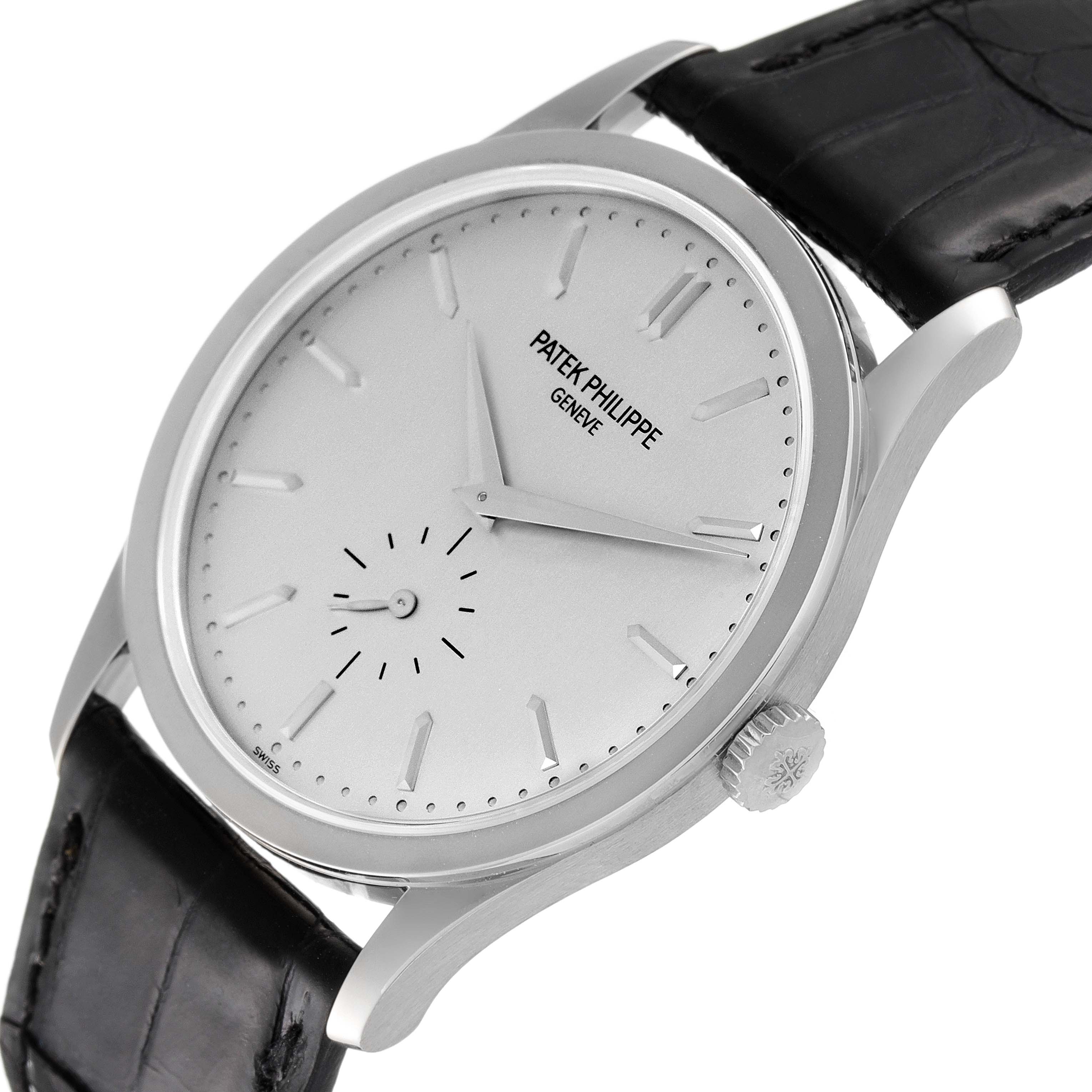 The image shows a Patek Philippe Calatrava 5196G Men's White Gold Silver Dial 5196G Men's White Gold Silver Dial watch in a slight side angle, highlighting the watch face, crown, and part of the strap.