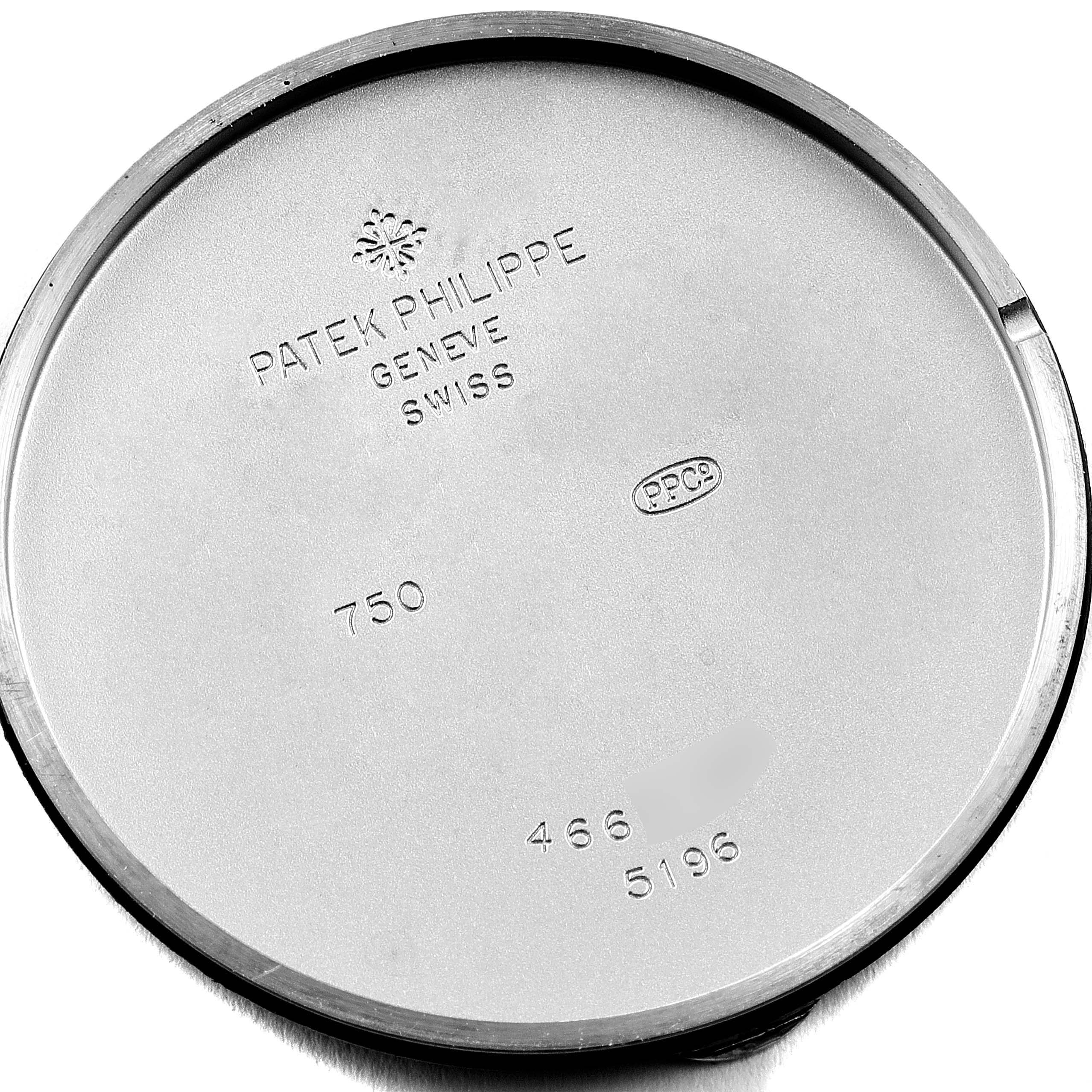 This image shows the inner case back of a Patek Philippe Calatrava 5196G Men's White Gold Silver Dial 5196G Men's White Gold Silver Dial watch, engraved with brand markings and model details.