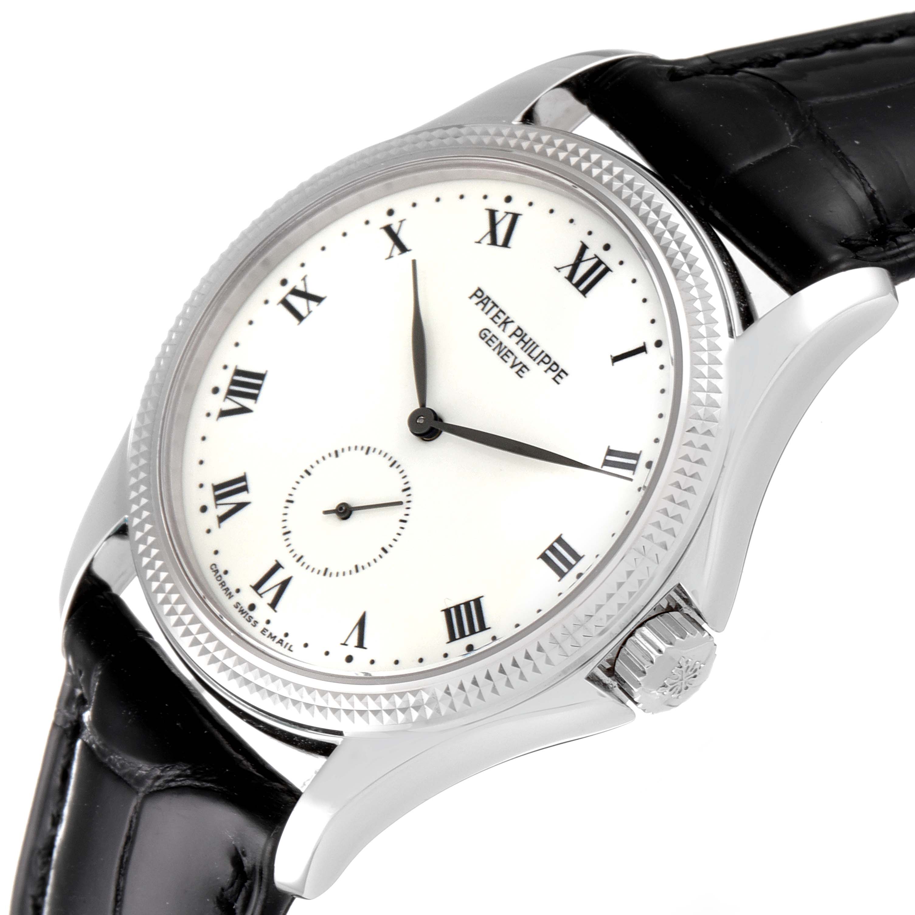 This image shows a close-up of the Patek Philippe Calatrava 5115G Men's White Gold White Dial 5115G Men's White Gold White Dial watch, highlighting its dial, bezel, crown, and black leather strap.
