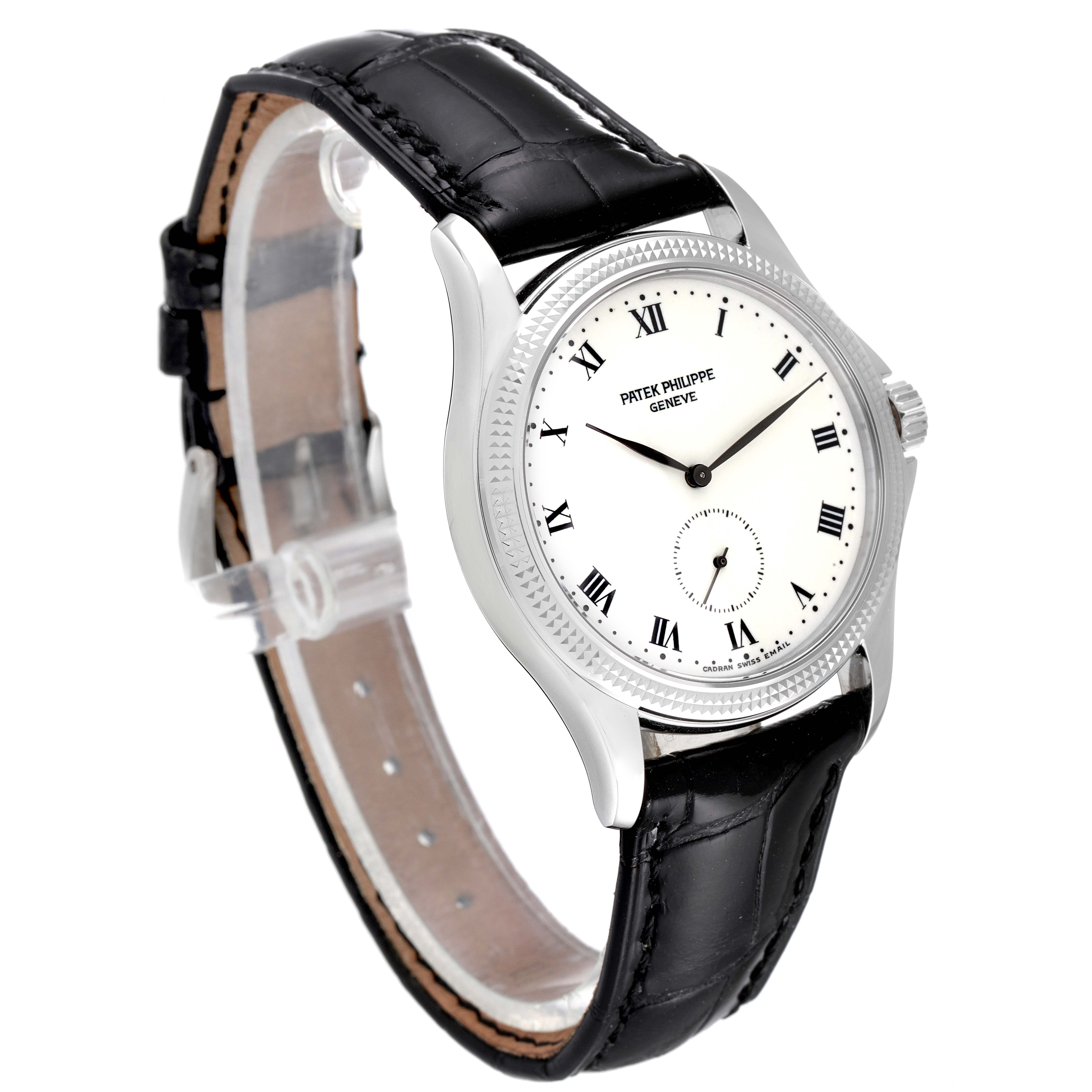 This image shows a Patek Philippe Calatrava 5115G Men's White Gold White Dial 5115G Men's White Gold White Dial watch at a three-quarter angle, displaying the face, case, and black leather strap.