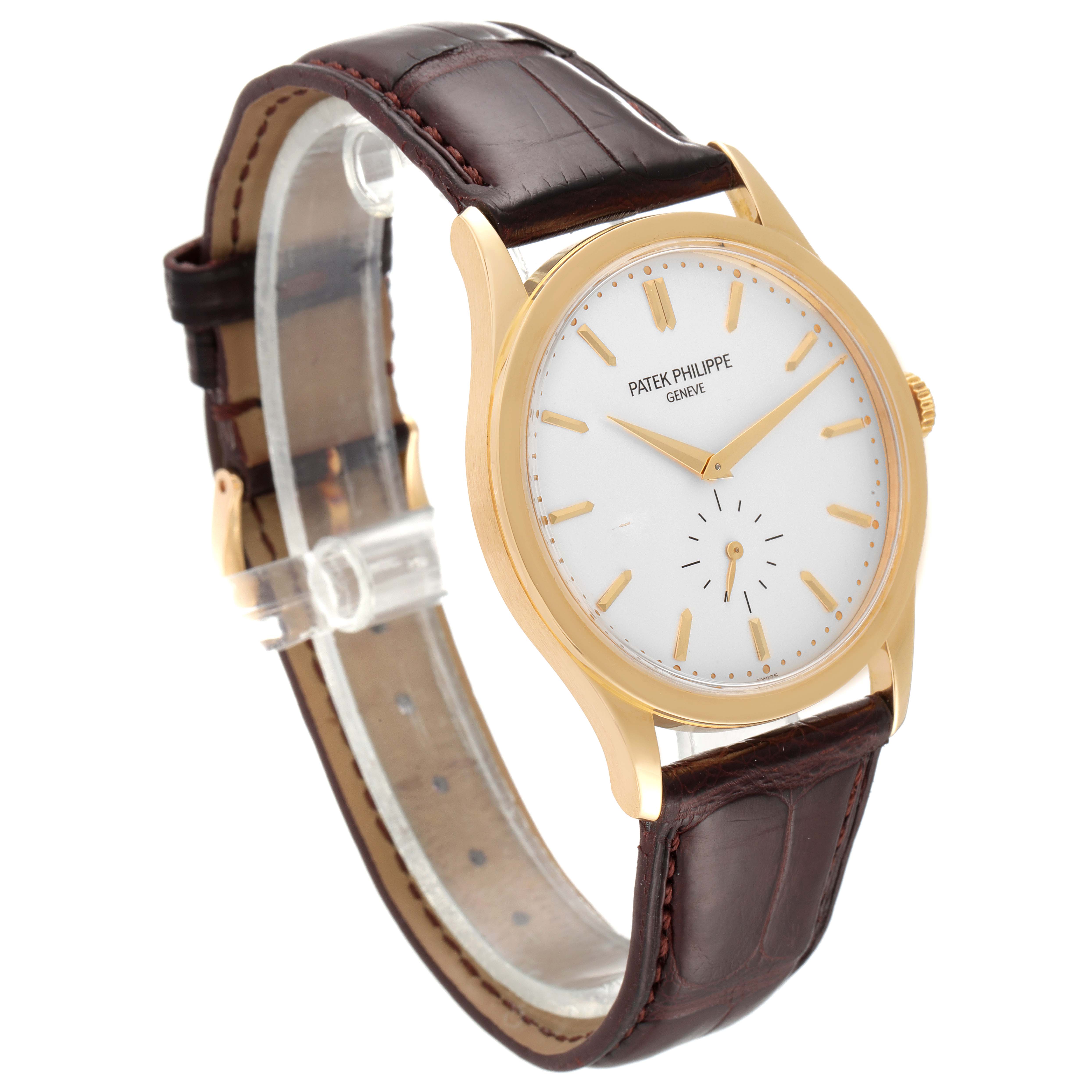 This image shows a Patek Philippe Calatrava 5196J Men's Yellow Gold Silver Dial 5196J Men's Yellow Gold Silver Dial watch from a front-side angle, highlighting the dial and leather strap.