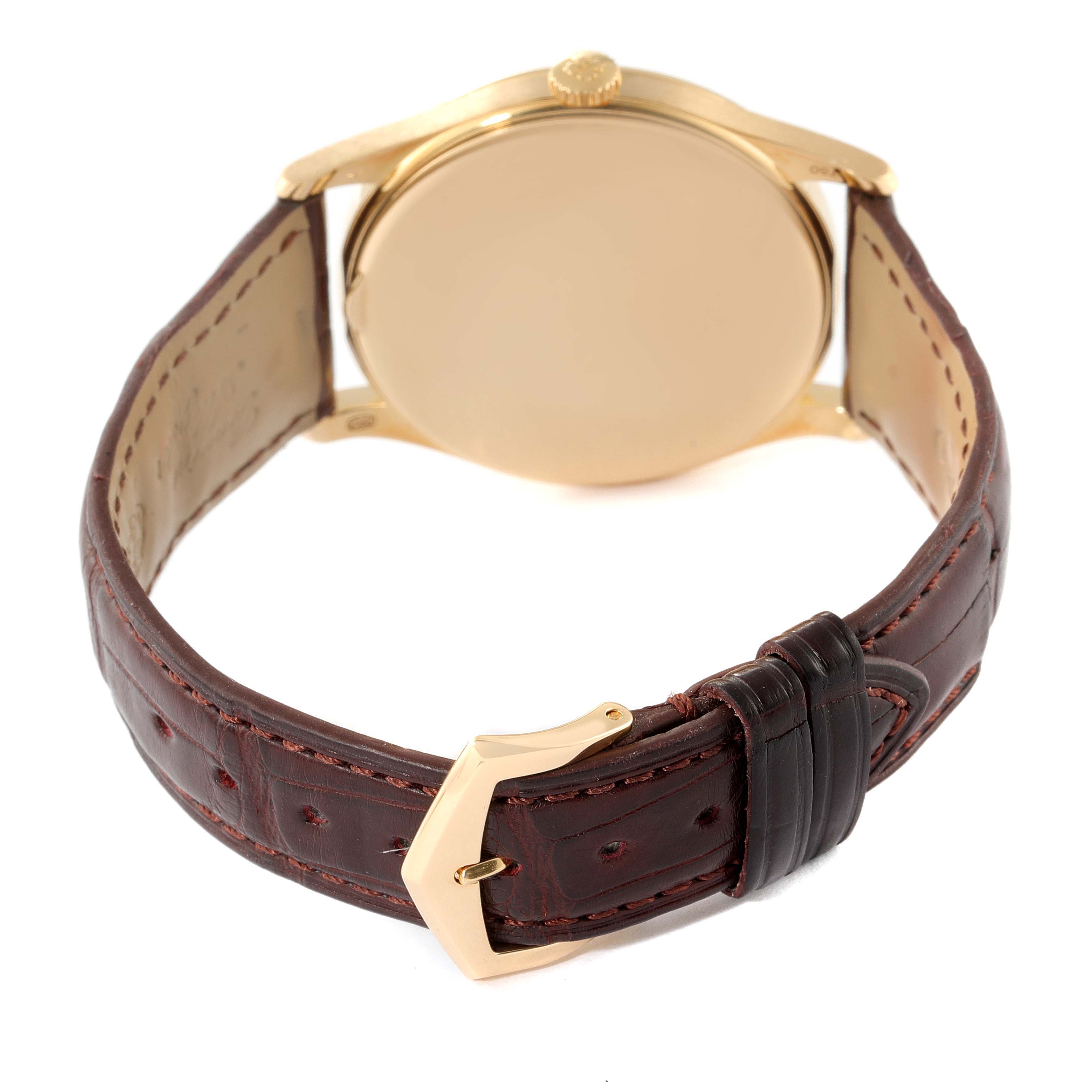 The image shows the back and strap of the Patek Philippe Calatrava 5196J Men's Yellow Gold Silver Dial 5196J Men's Yellow Gold Silver Dial watch, highlighting its brown leather band and gold clasp.