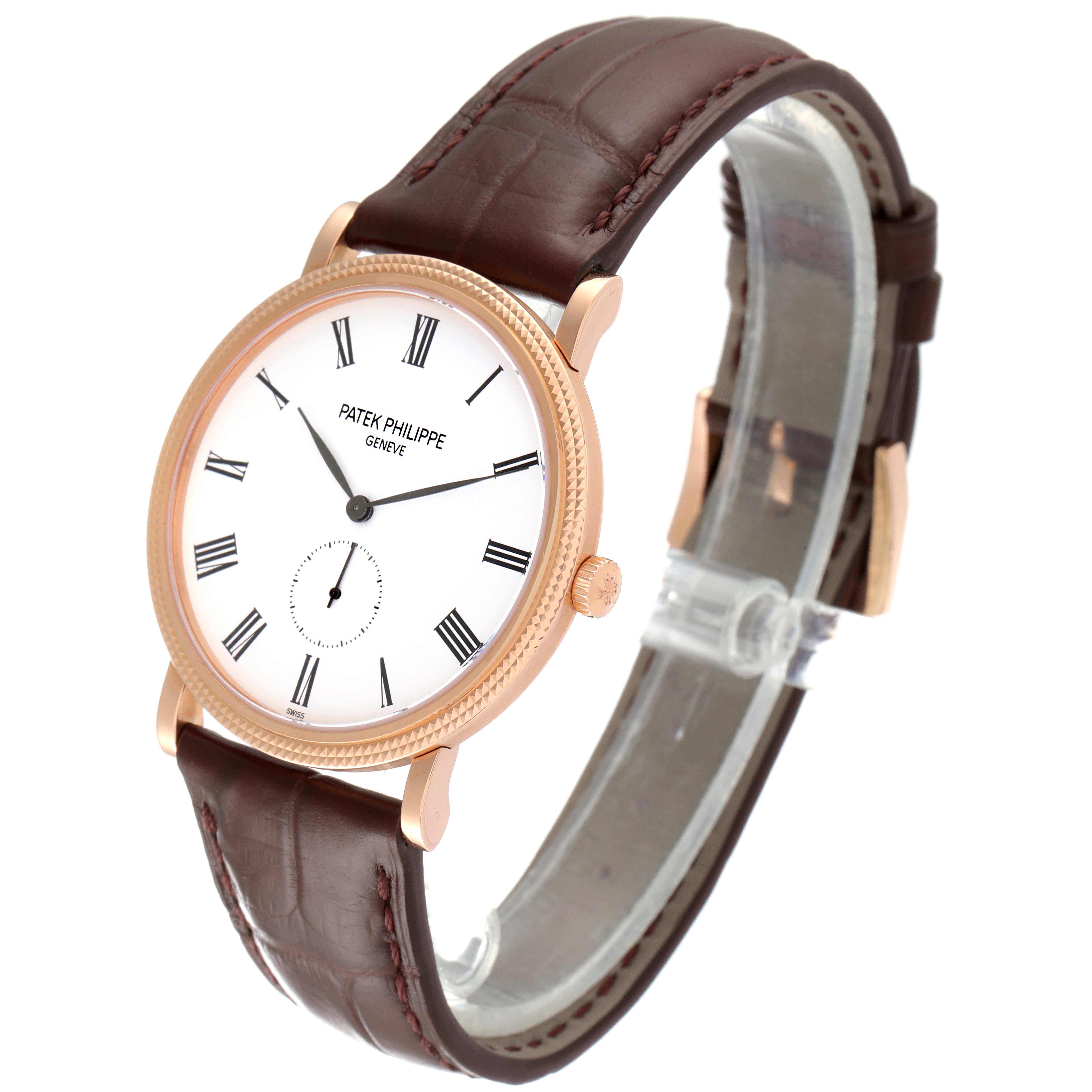 The Patek Philippe Calatrava 5119R Men's Rose Gold White Dial 5119R Men's Rose Gold White Dial watch is shown from a front angle, displaying its face, crown, and leather strap.