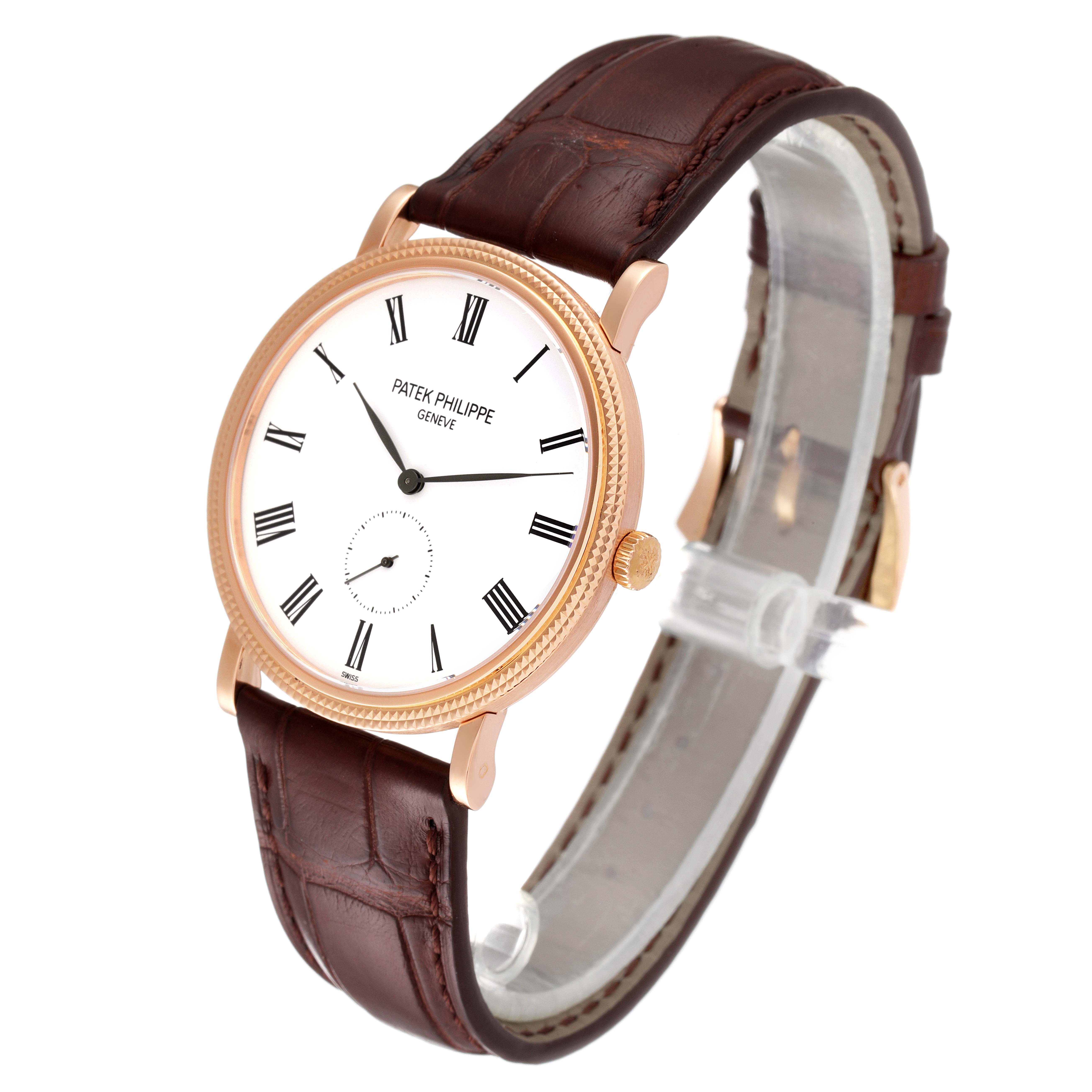 The image shows a Patek Philippe Calatrava 5119R-001 Men's Rose Gold White Dial 5119R-001 Men's Rose Gold White Dial watch at a slight angle, highlighting its white dial, Roman numerals, and brown leather strap.
