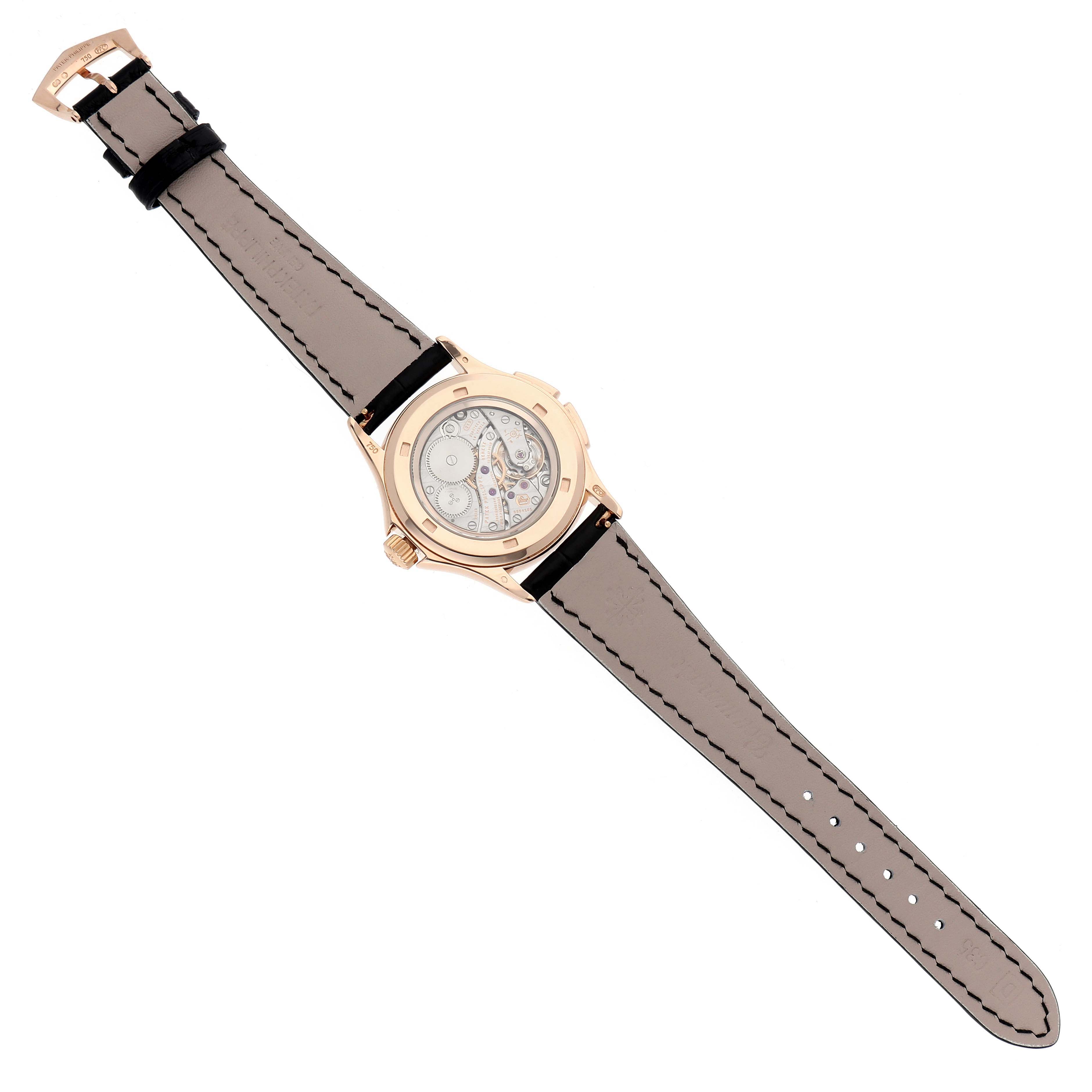 The image shows the back view of a Patek Philippe Calatrava 4934R-001 Women's Rose Gold Brown Dial watch, highlighting the movement and leather strap.