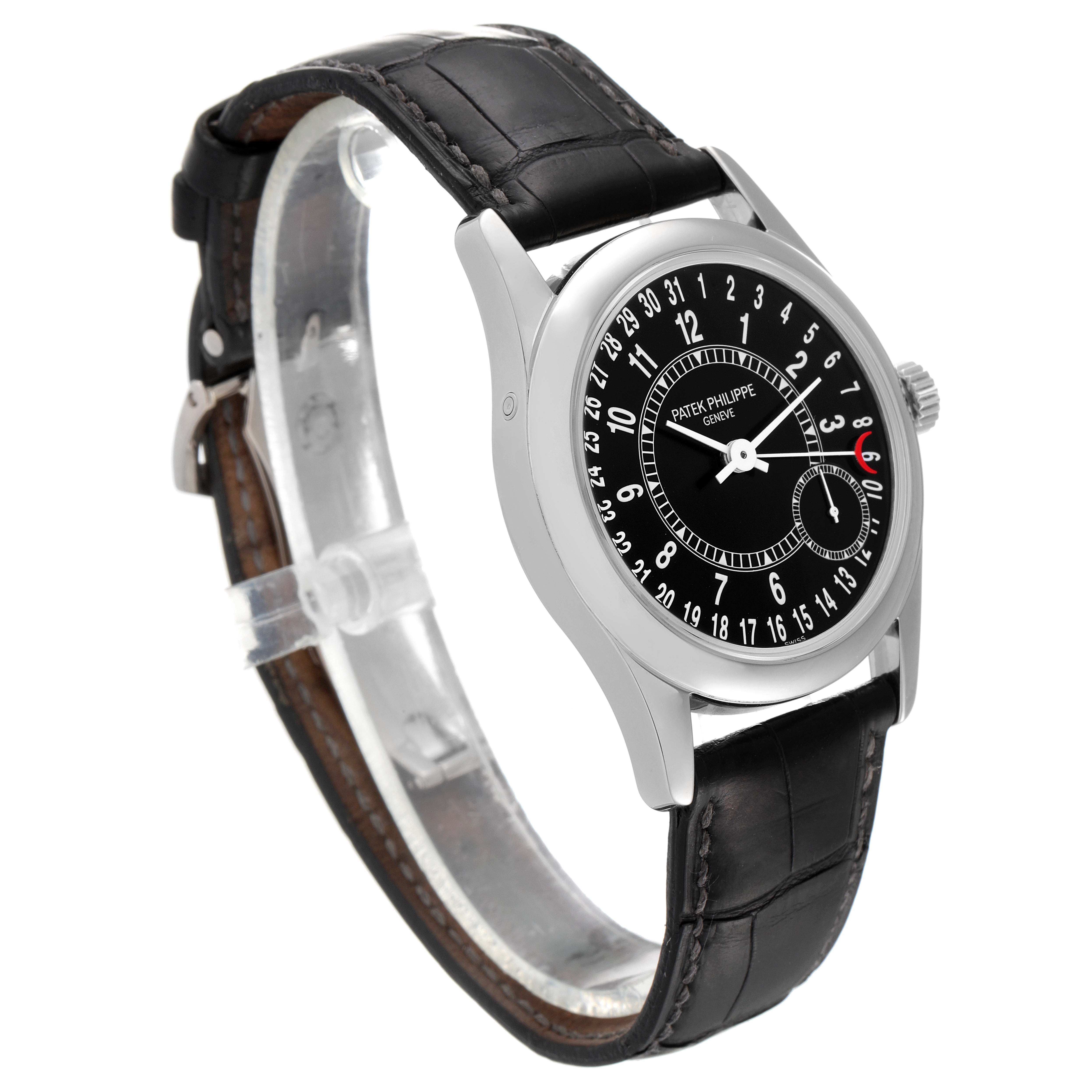The image shows the Patek Philippe Calatrava 6000G Men's White Gold Black Dial 6000G Men's White Gold Black Dial model watch from a side and slightly angled front view, featuring its dial, case, and leather strap.