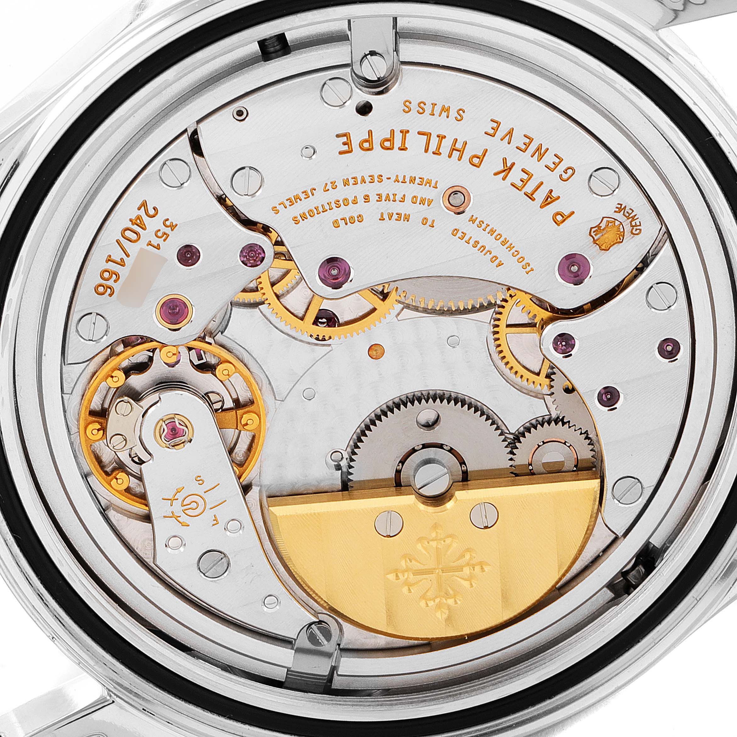The image shows the back view of the Calatrava model by Patek Philippe, highlighting the intricate movement and internal mechanisms.