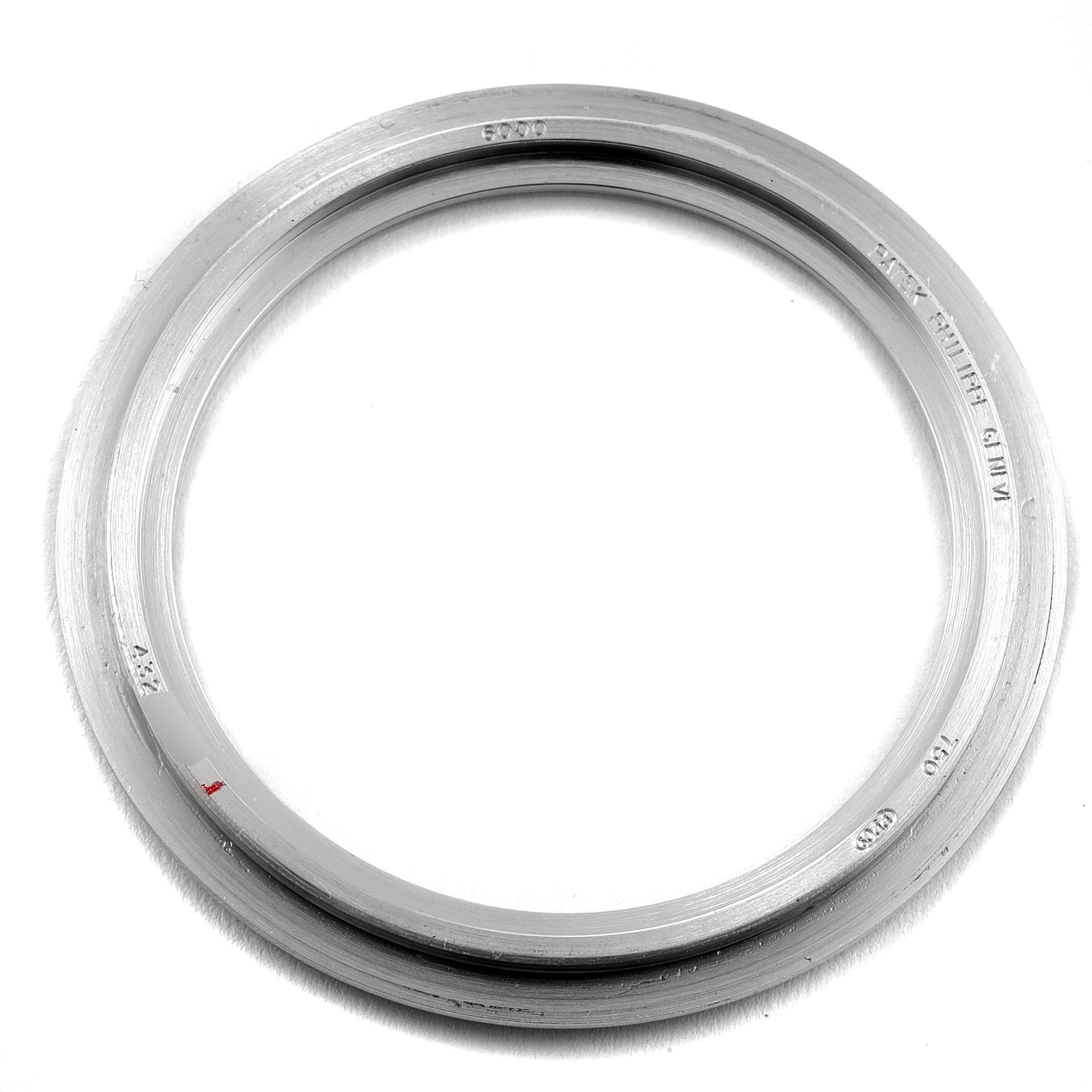 This image shows a stainless steel fixed bezel for the Calatrava model by Patek Philippe, viewed from a top-down angle.