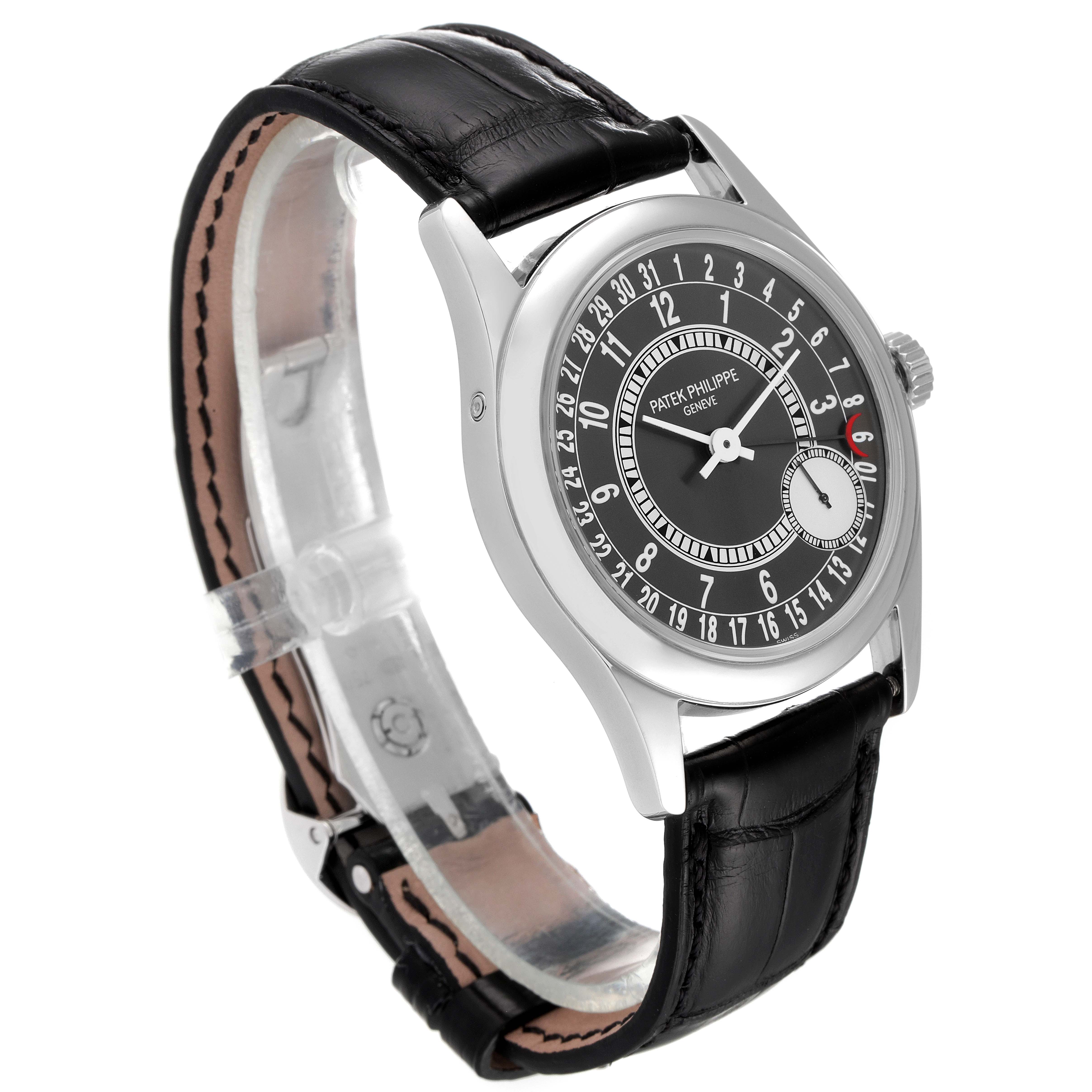 The Patek Philippe Calatrava 6000G Men's White Gold Grey Dial 6000G Men's White Gold Grey Dial watch is shown at a three-quarter angle, highlighting its black dial and leather strap.