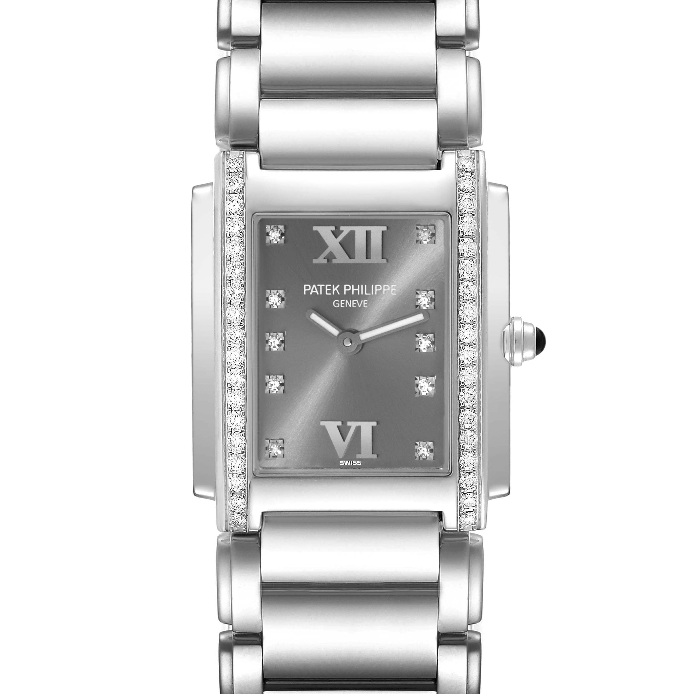 The image shows a front view of the Patek Philippe Twenty-4 4910/10A Women's Stainless Steel Grey Dial 4910/10A Women's Stainless Steel Grey Dial watch, highlighting its face, bracelet, and diamond accents.