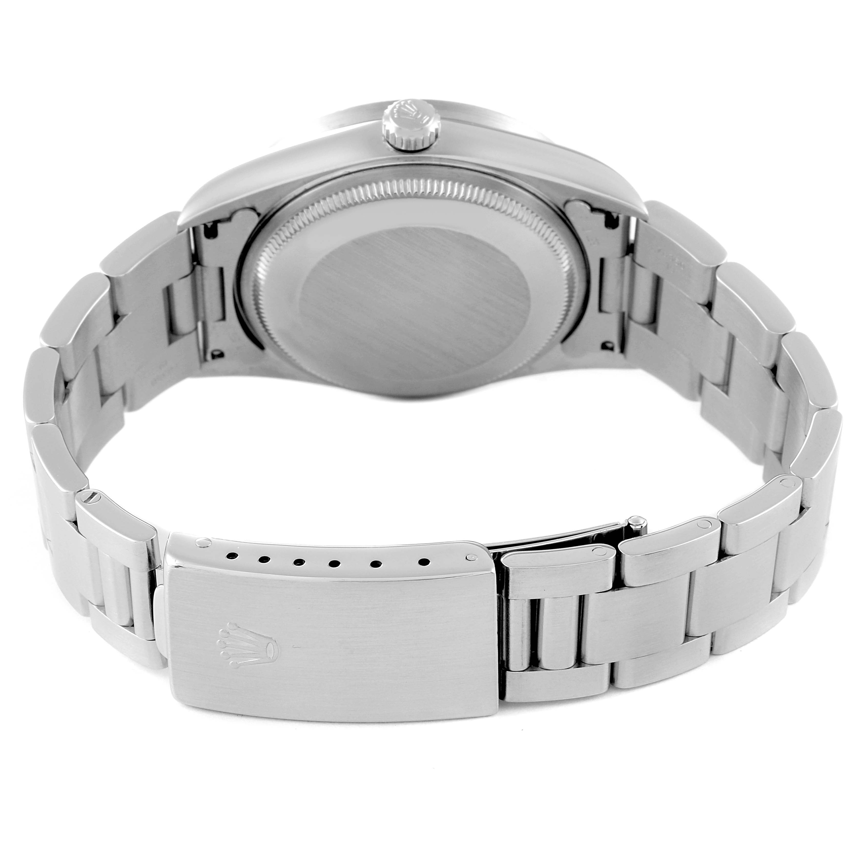 The image shows the back side and clasp of a Rolex Air-King 14010 Men's Stainless Steel Black Dial 14010 Men's Stainless Steel Black Dial watch in a partially opened position.