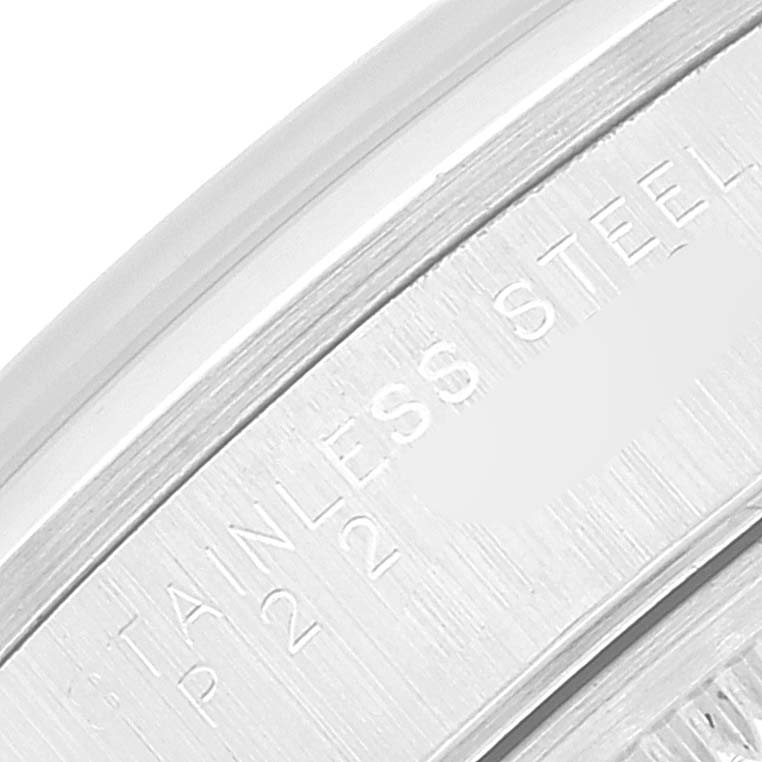 This close-up image shows the engraved text "STAINLESS STEEL" on the bezel of a Rolex Air-King 14000 Men's Stainless Steel Pink Dial 14000 Men's Stainless Steel Pink Dial watch.