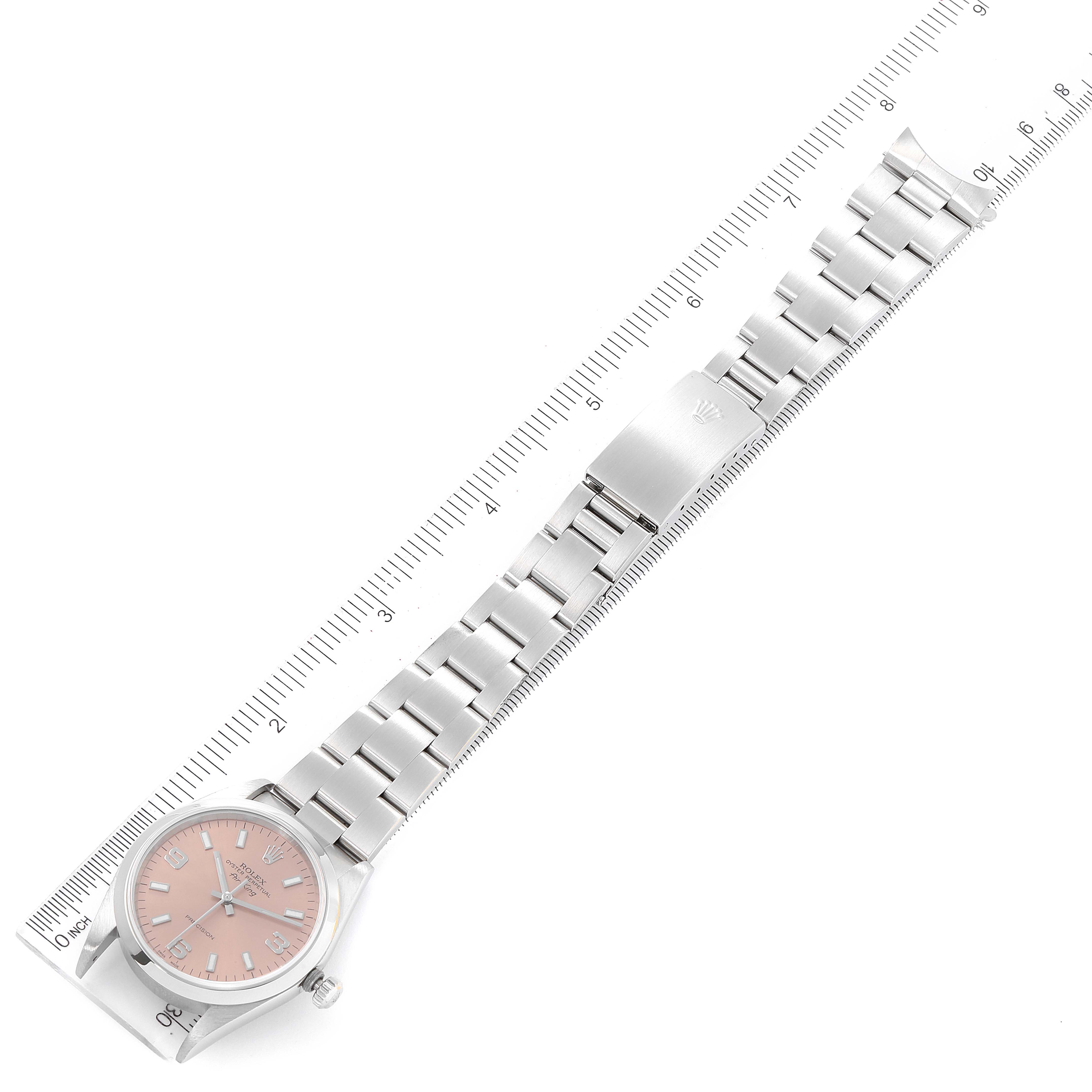 This image shows a Rolex Air-King 14000 Men's Stainless Steel Pink Dial 14000 Men's Stainless Steel Pink Dial watch from a top-down angle, including the dial, bracelet, and clasp, along with a measuring ruler.