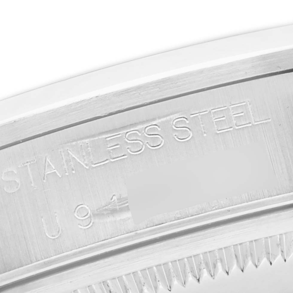 The image shows a close-up of the stainless steel case back of a Rolex Air-King 14000 Men's Stainless Steel Silver Dial watch.