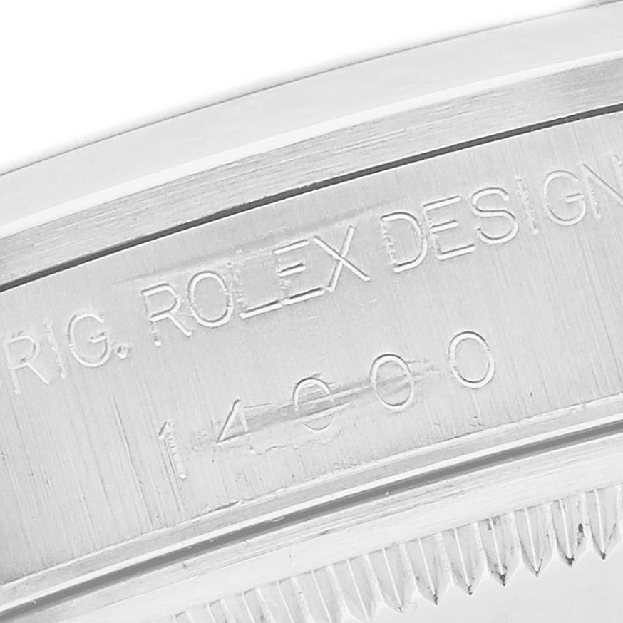 The image shows a close-up of the Rolex Air-King 14000 Men's Stainless Steel Silver Dial model's watch bezel and engraved serial number.