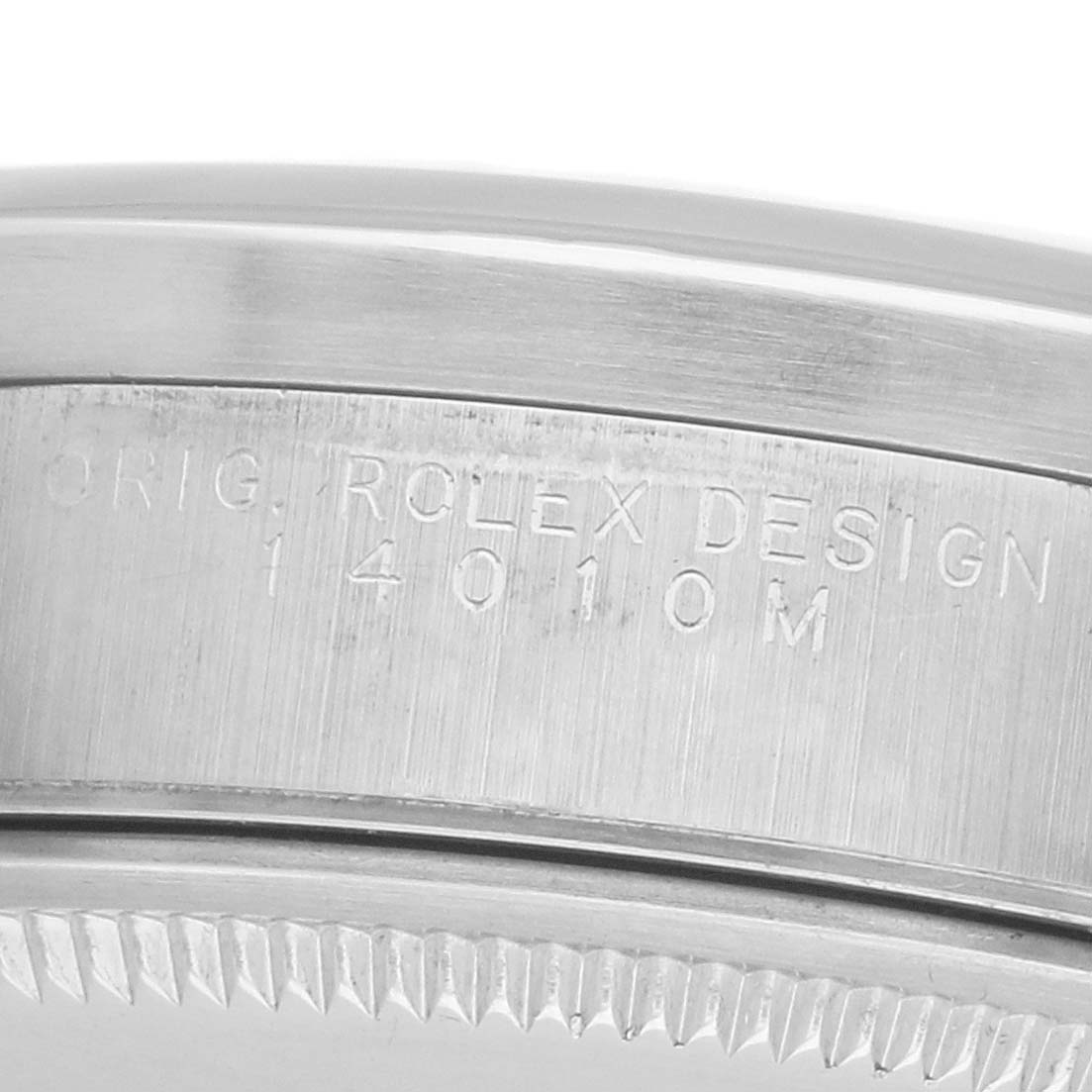 The image shows a close-up of the side and bezel edge of a Rolex Air-King 14010 Men's Stainless Steel Silver Dial watch, highlighting its engravings.