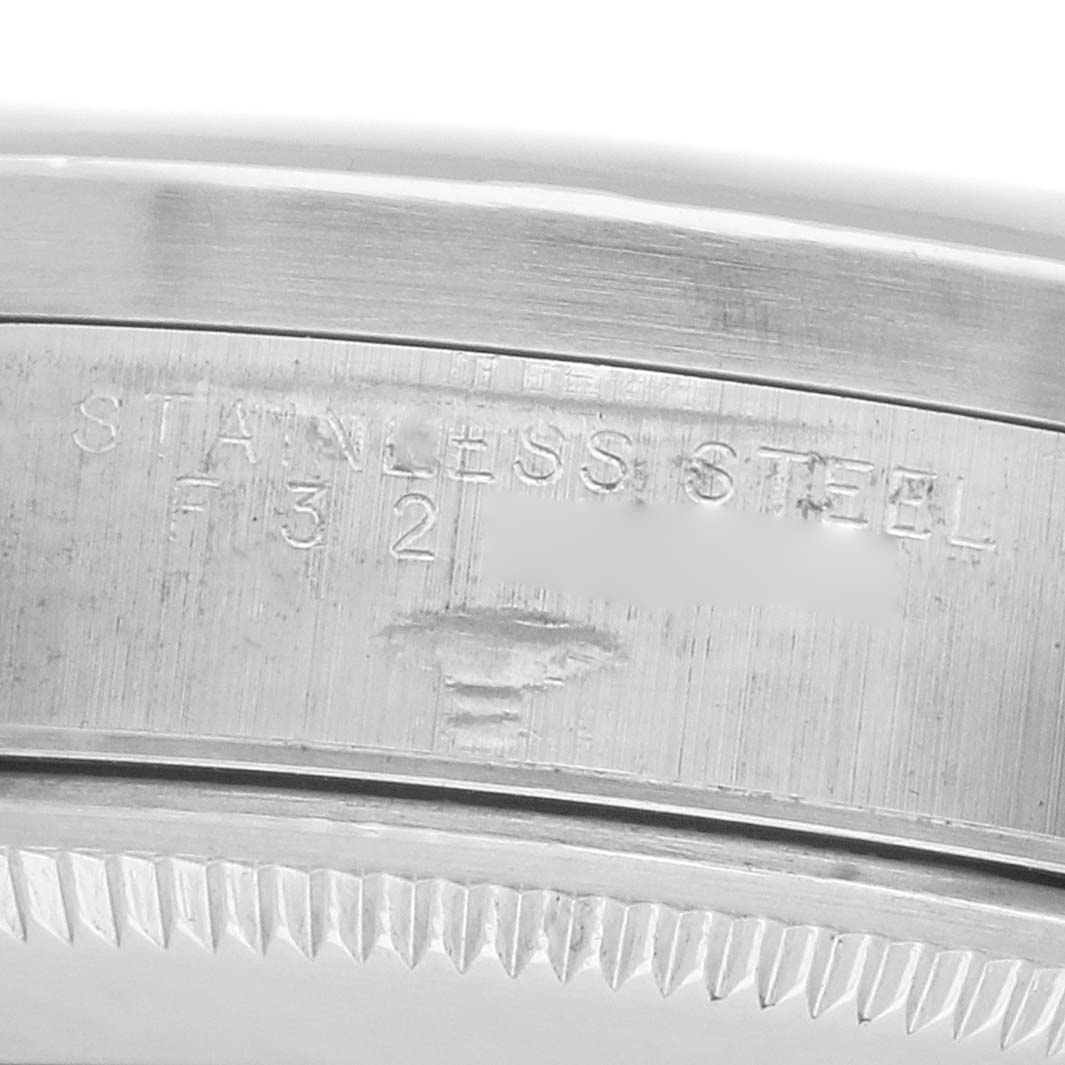 The image shows a close-up of the bezel and case side of the Rolex Air-King 14010 Men's Stainless Steel Silver Dial, highlighting its stainless steel material.